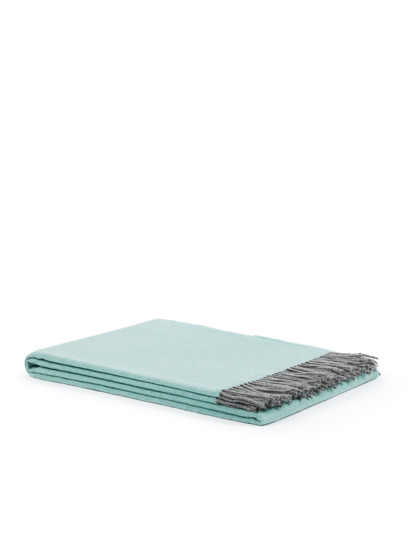Mint green folded throw with grey fringe trim, shown against white background.