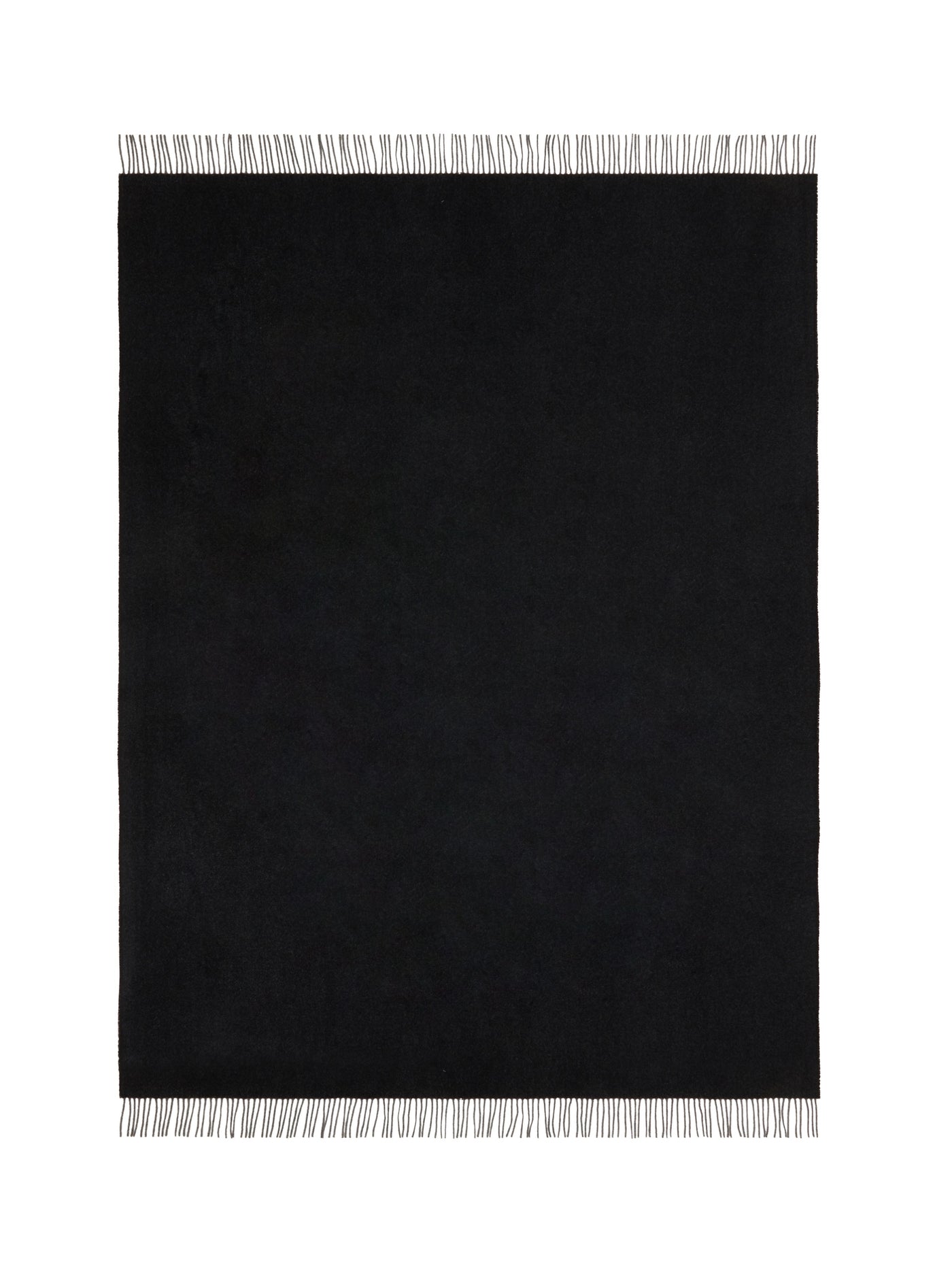 Close-up of Lanerossi Everest Colour throw in black with contrast ivory fringe trim.