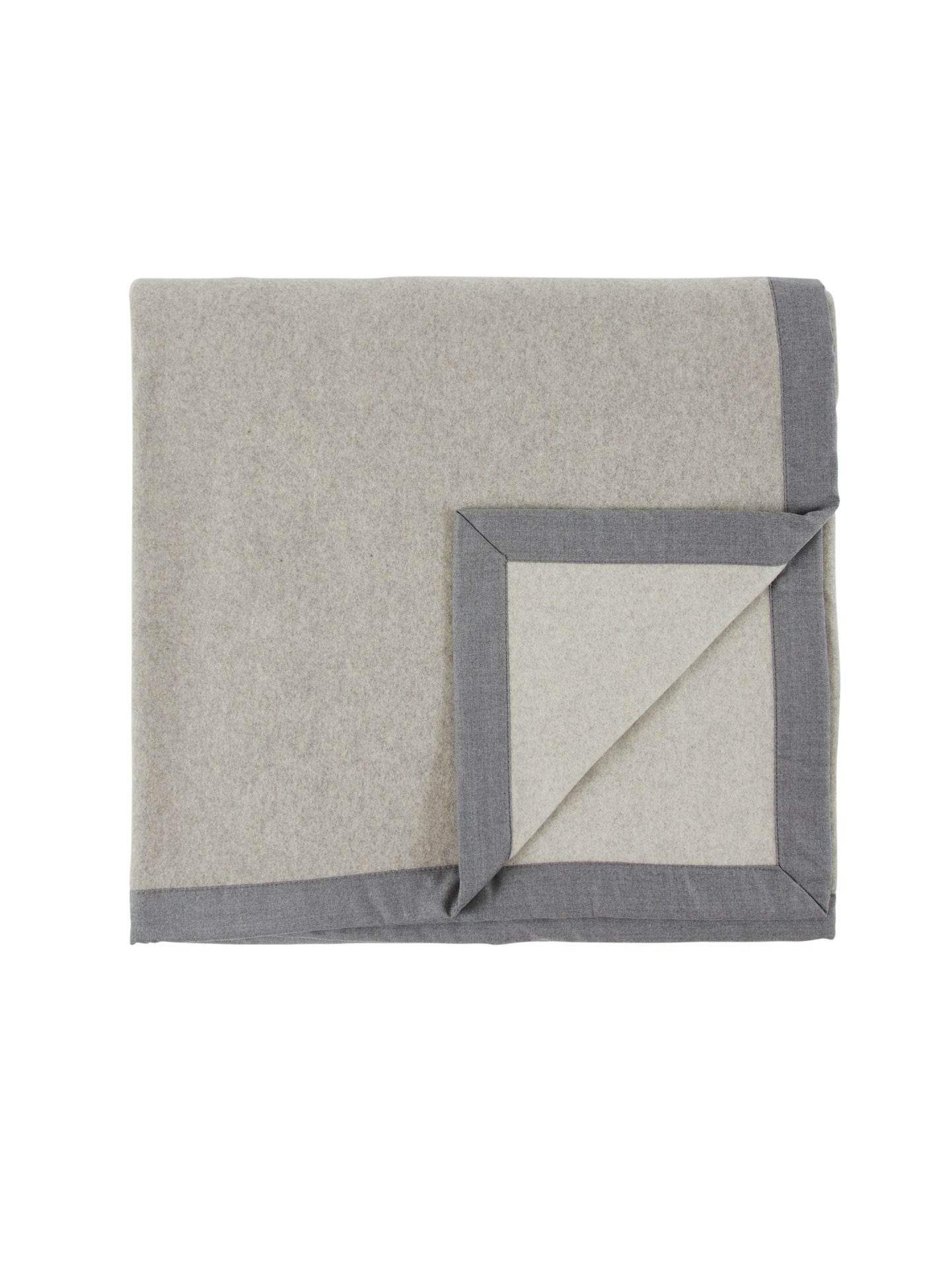 Folded oatmeal wool blanket with slate grey border trim, corner turned back.