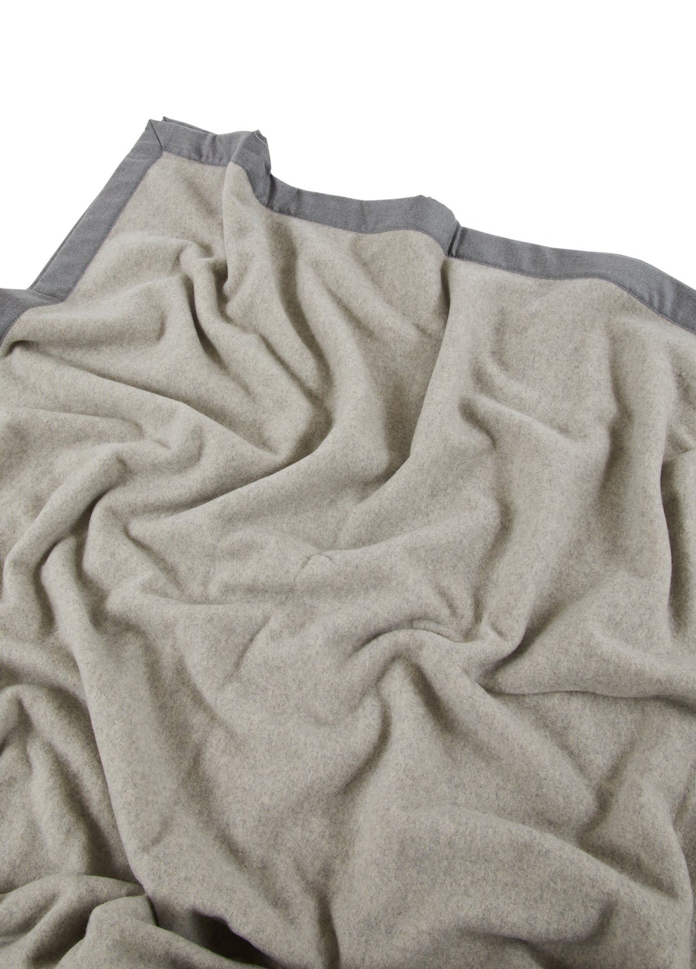 Close-up of Lanerossi Geisha blanket in oatmeal with contrast grey border trim.