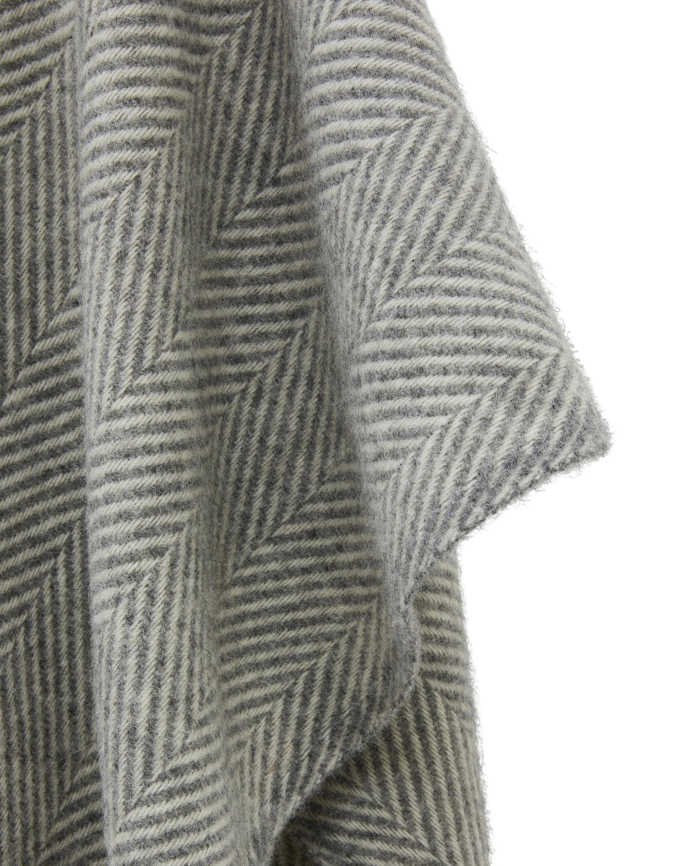 Close-up of Lanerossi Iseo Spina poncho showing herringbone weave texture in grey tones.
