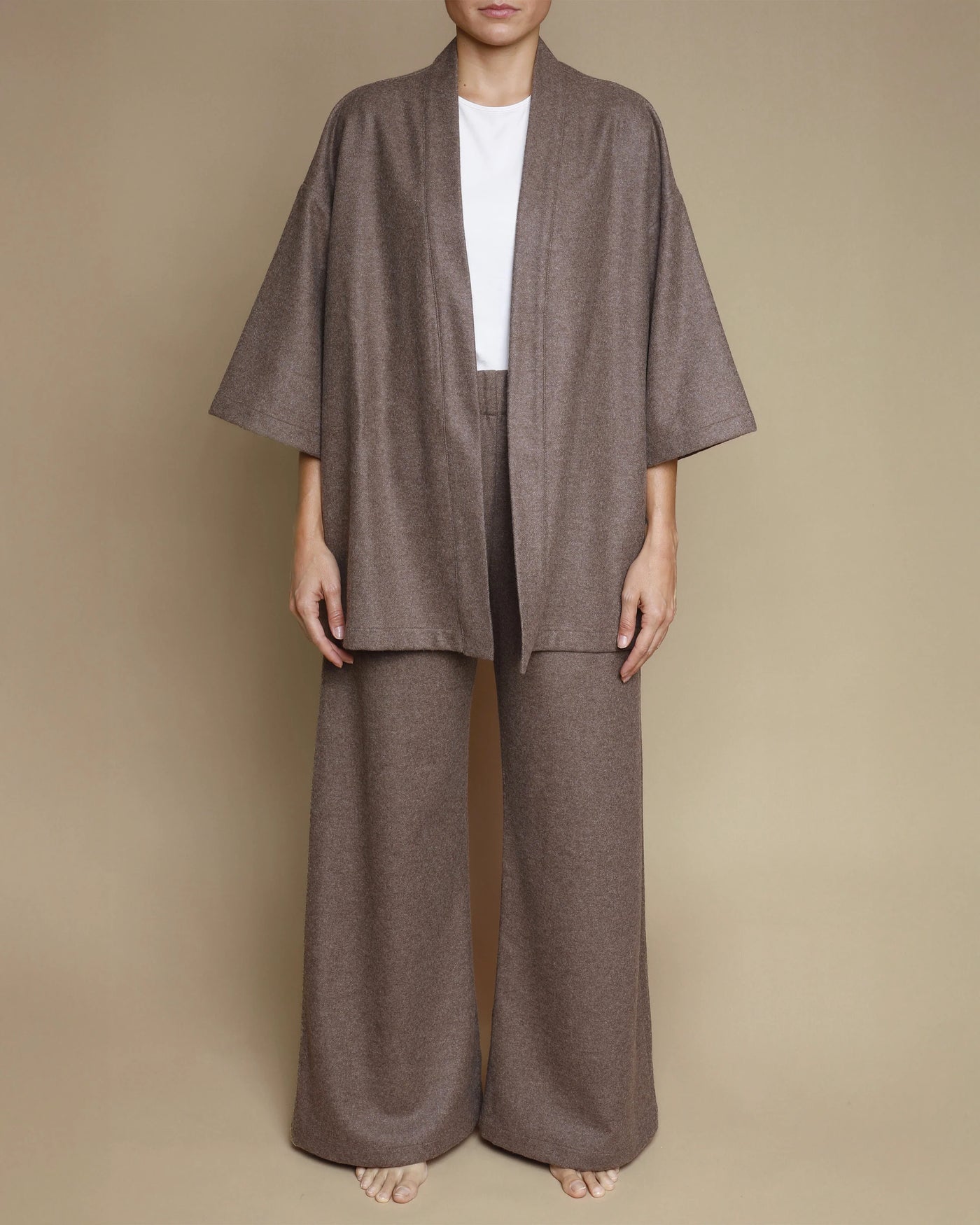 Lanerossi Extrafine Merino kimono jacket in taupe, styled open over wide-leg trousers.