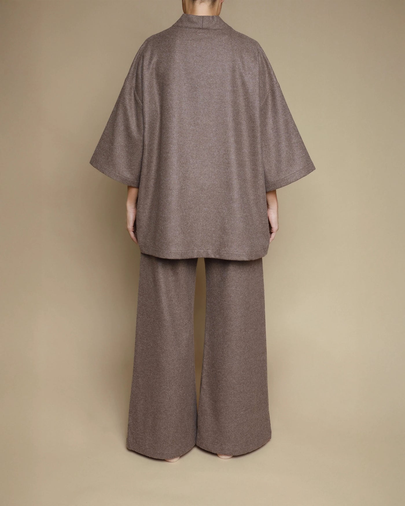 Back view of Lanerossi kimono jacket and wide-leg pants in taupe merino wool.