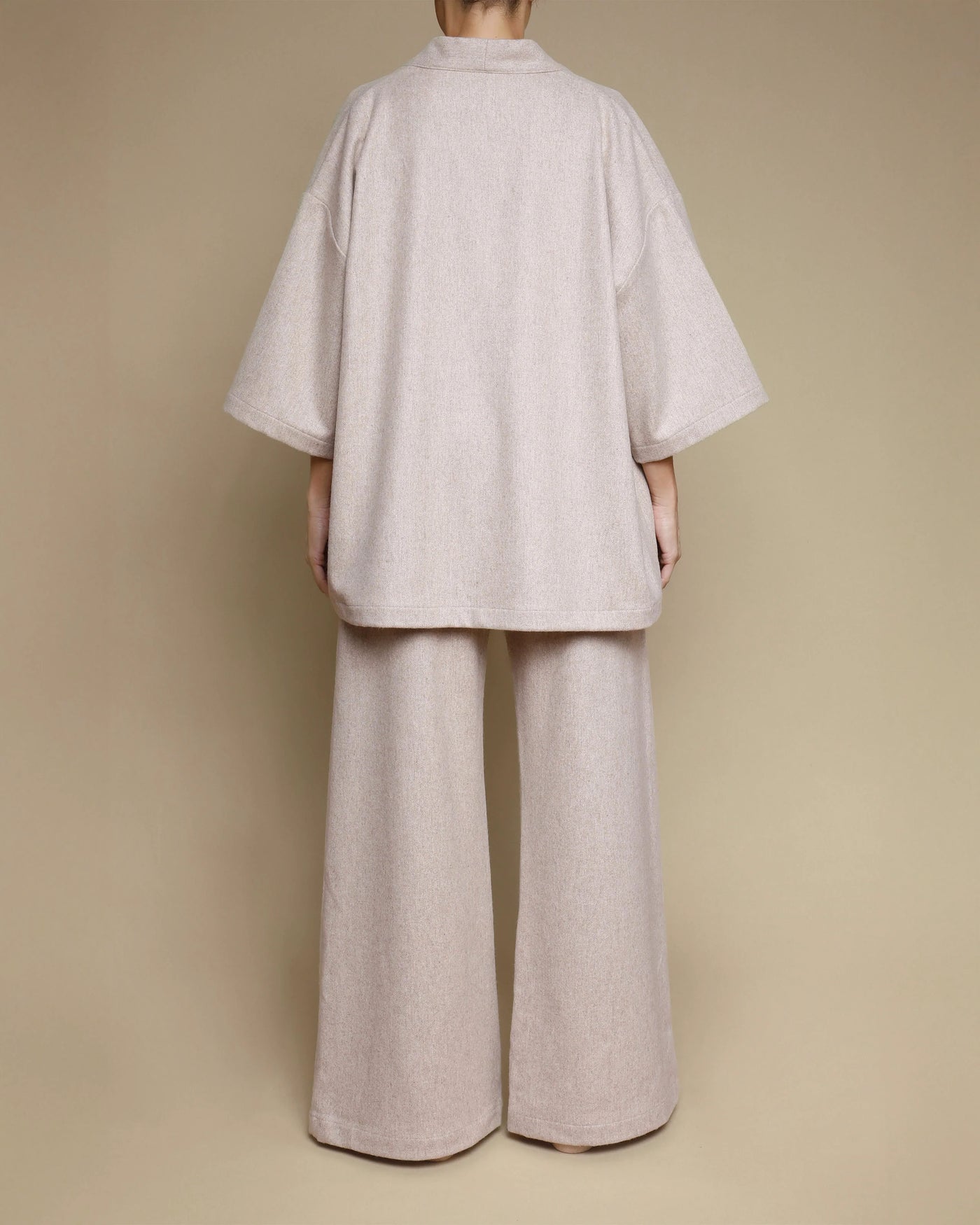 Back view of Lanerossi kimono jacket and wide-leg pants set in oatmeal merino wool.