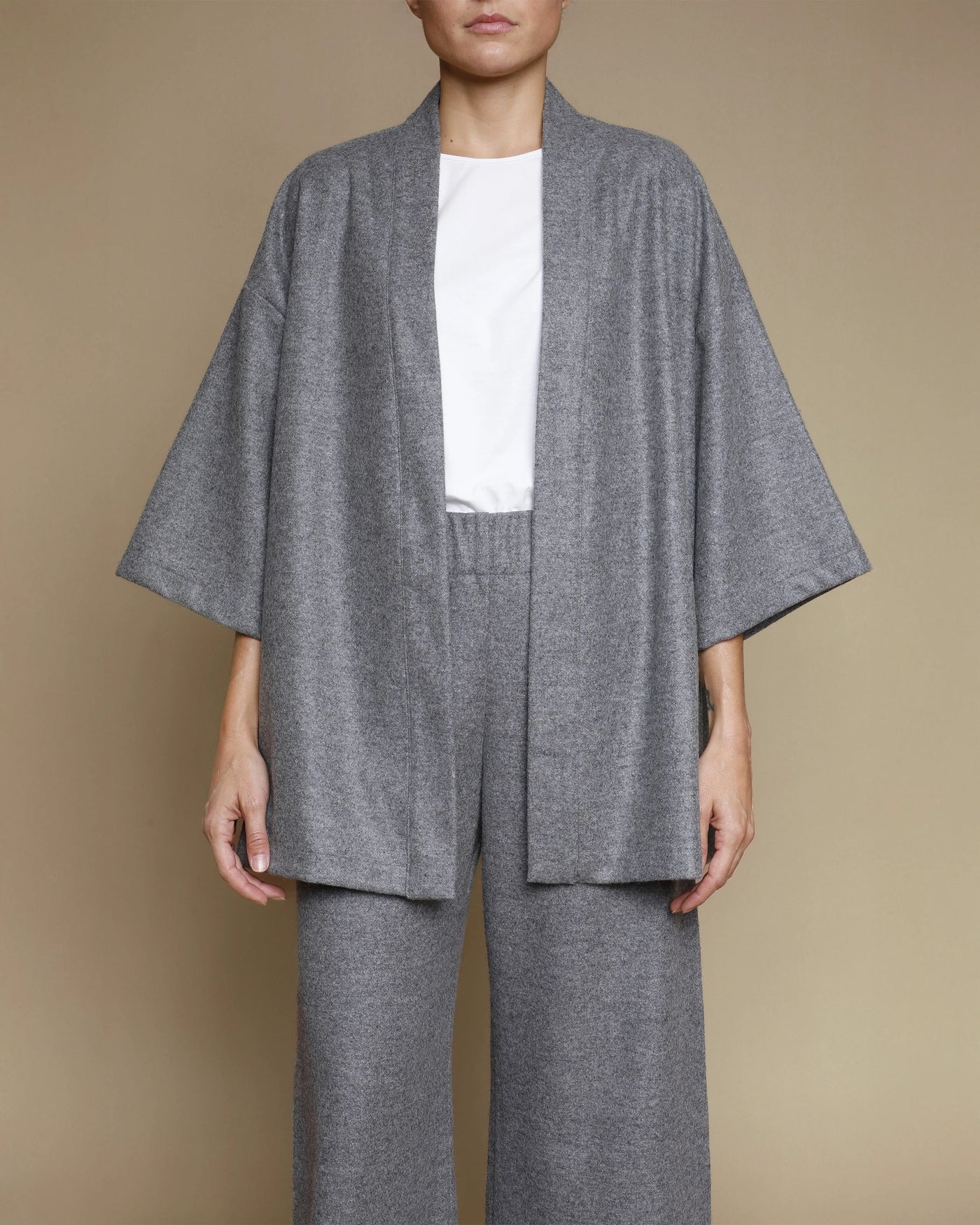 Heathered grey merino kimono jacket styled open over matching wide-leg trousers.