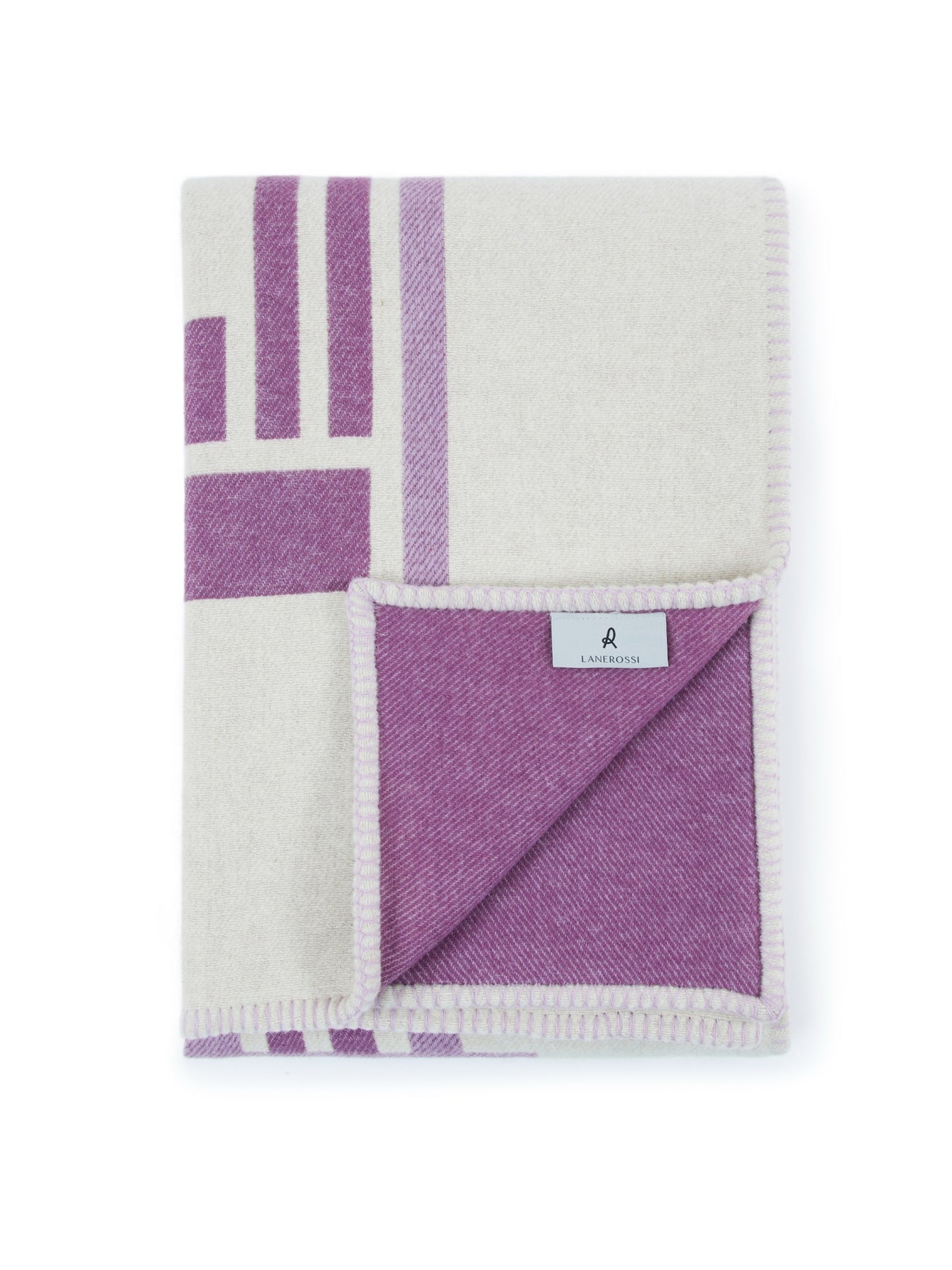 Lanerossi Metropolis throw folded to reveal violet herringbone reverse and brand label.