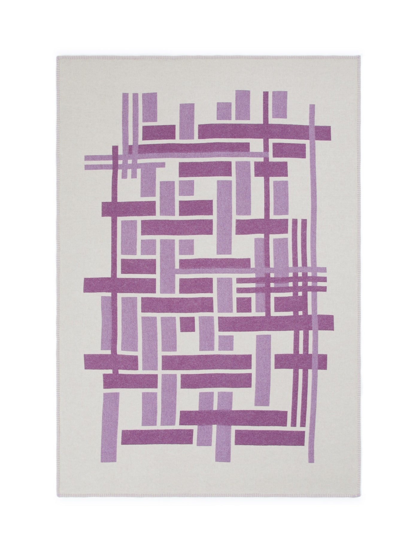 Lanerossi Metropolis throw, close-up of purple geometric grid pattern on ivory ground.
