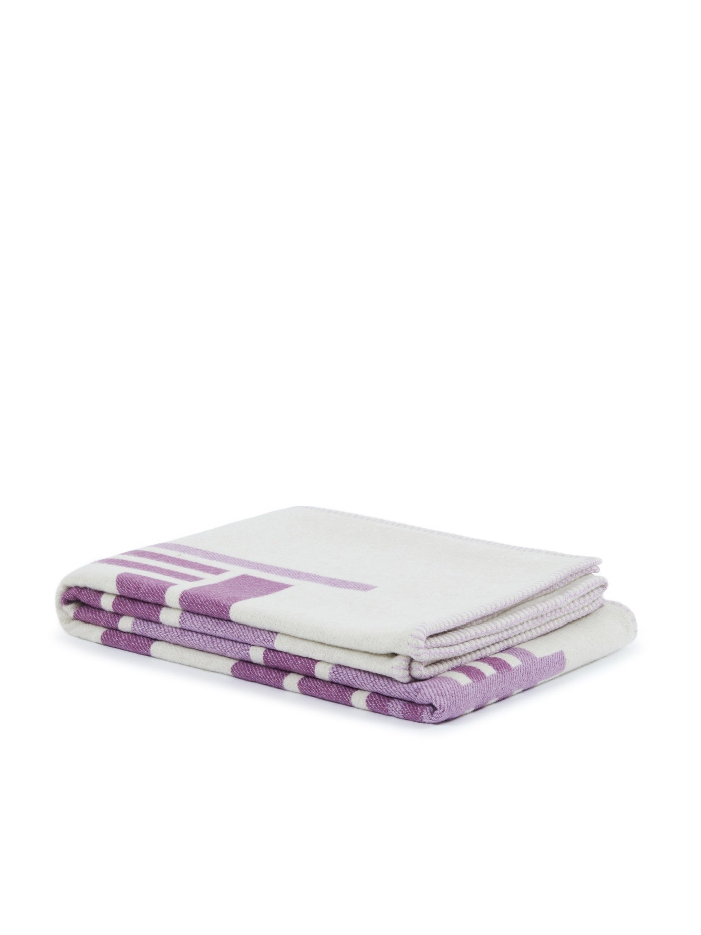 Lanerossi Metropolis throw folded, ivory with violet geometric block pattern visible on edges.