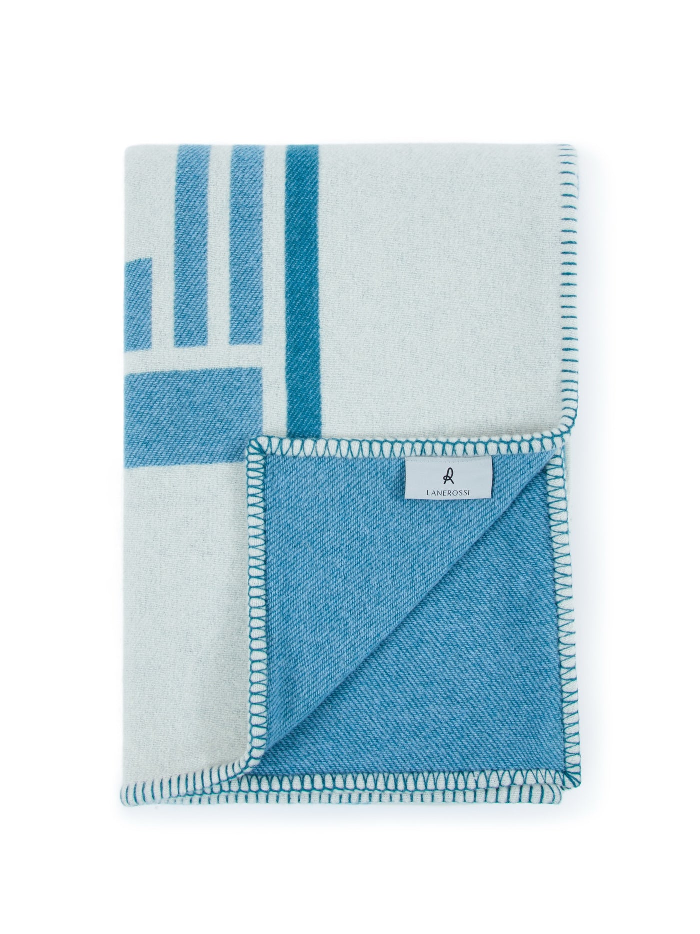 Lanerossi Metropolis throw folded, showing reverse aqua blue side with blanket-stitch edge trim.