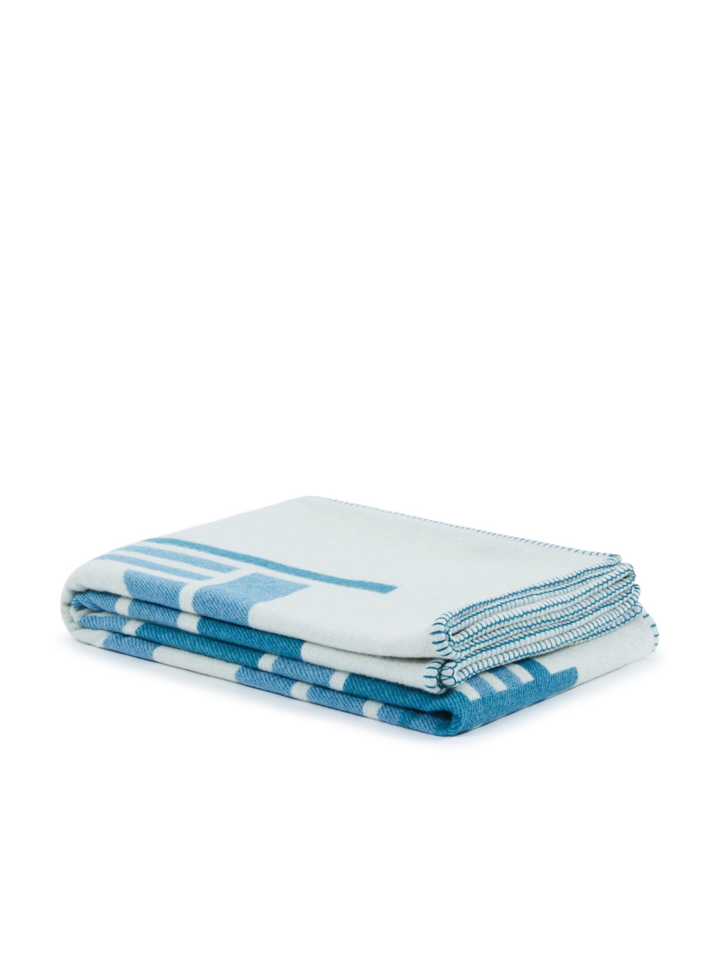 Lanerossi Metropolis throw folded, ivory with bold aqua geometric stripe pattern.