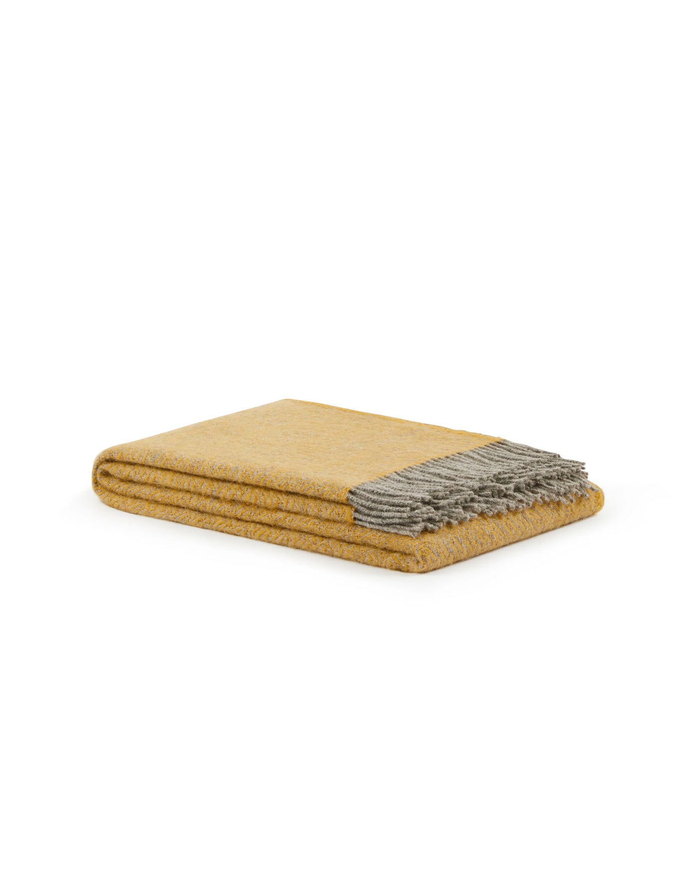Folded mustard wool throw with grey fringe trim, angled product view.