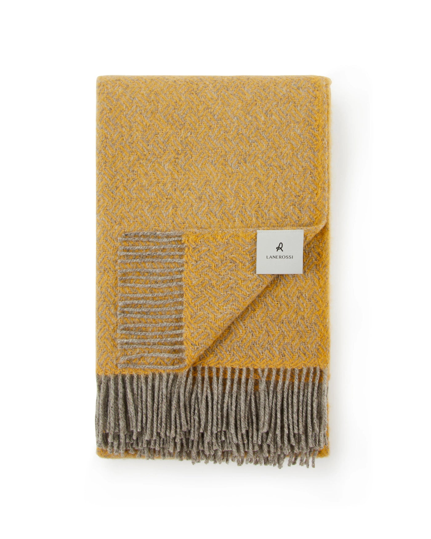 Lanerossi Mata Mata throw folded flat, mustard and grey wool with fringe trim.