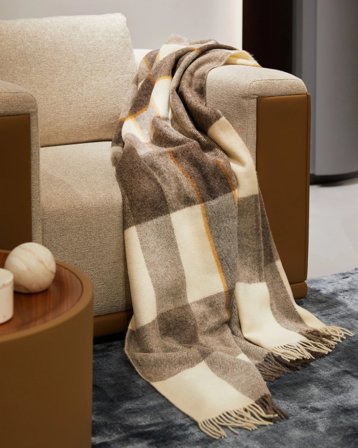 Lanerossi Nelson throw in taupe and ivory plaid with gold stripe, draped over armchair.