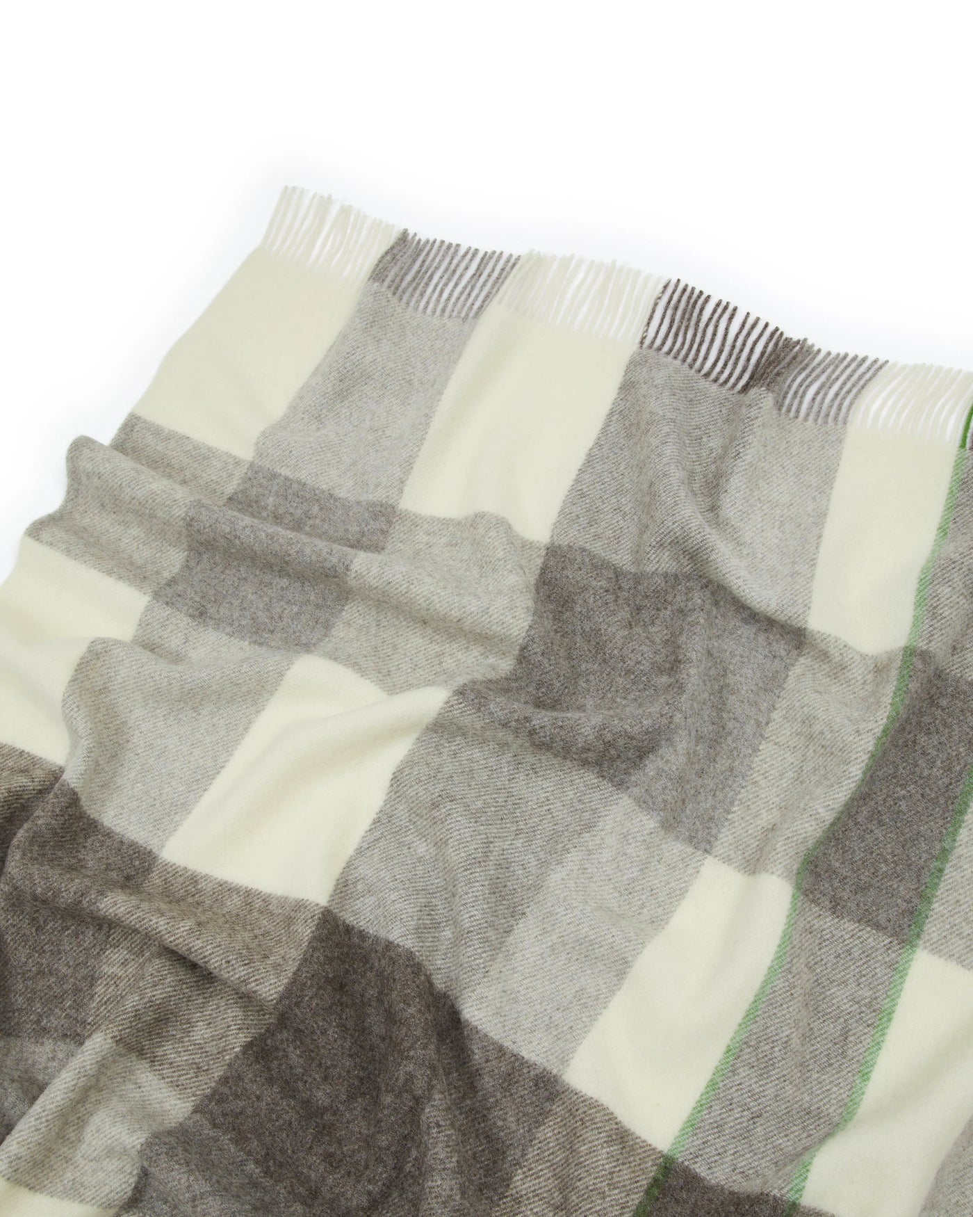 Close-up of Lanerossi Nelson throw hem with fringe, ivory and grey plaid pattern.