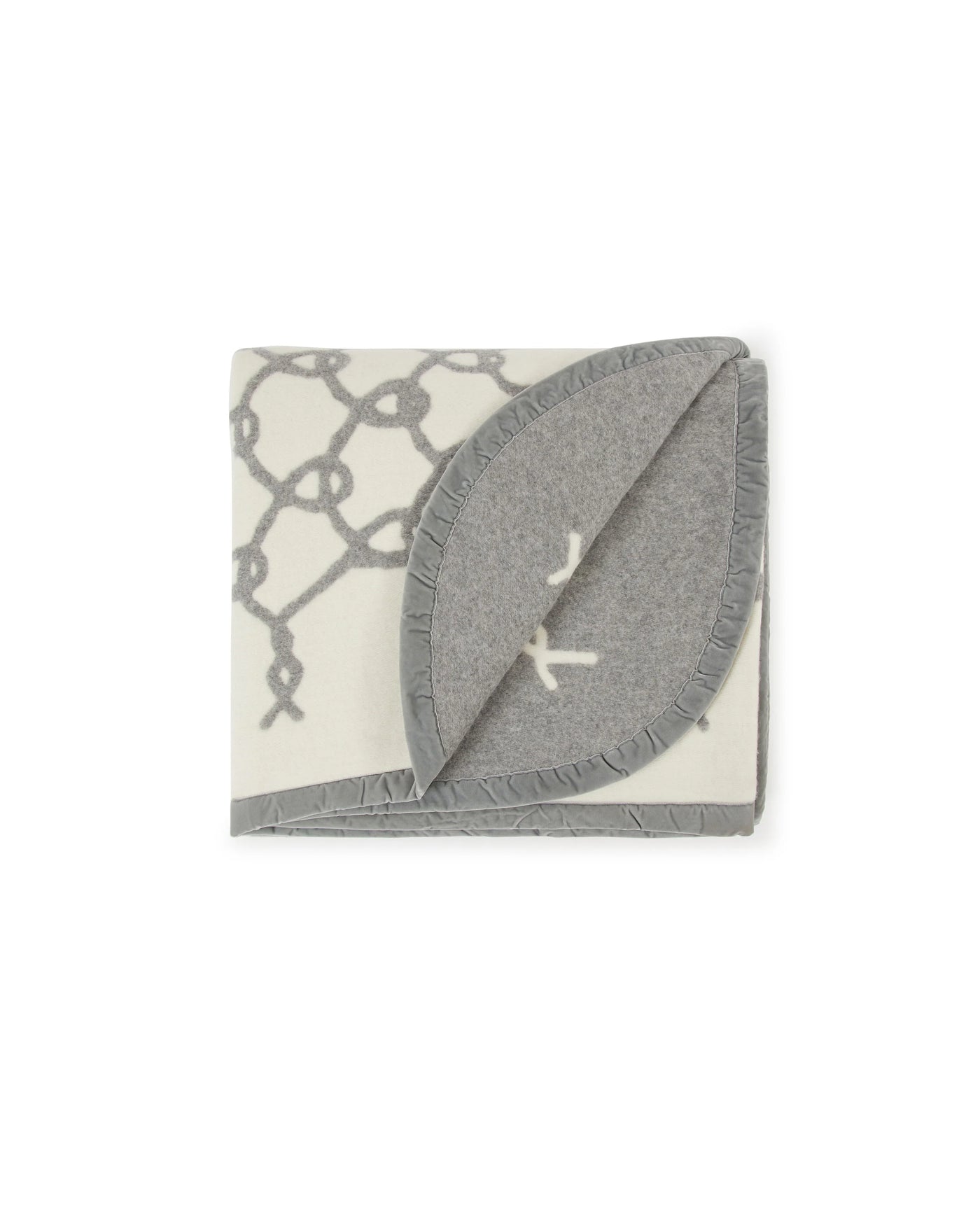 Lanerossi Net blanket corner folded back, revealing grey reverse with ivory whip-stitch trim.