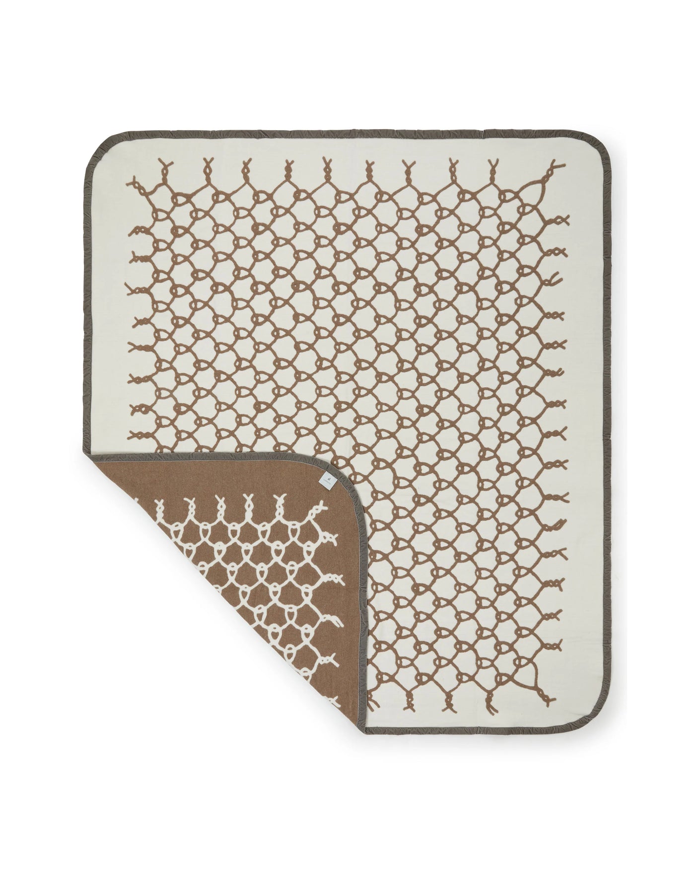 Lanerossi Net blanket corner folded back showing camel reverse side and ivory net pattern.