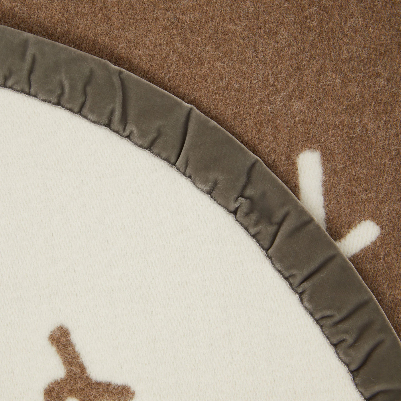 Close-up of Lanerossi Net blanket ivory wool with taupe satin trim binding detail.