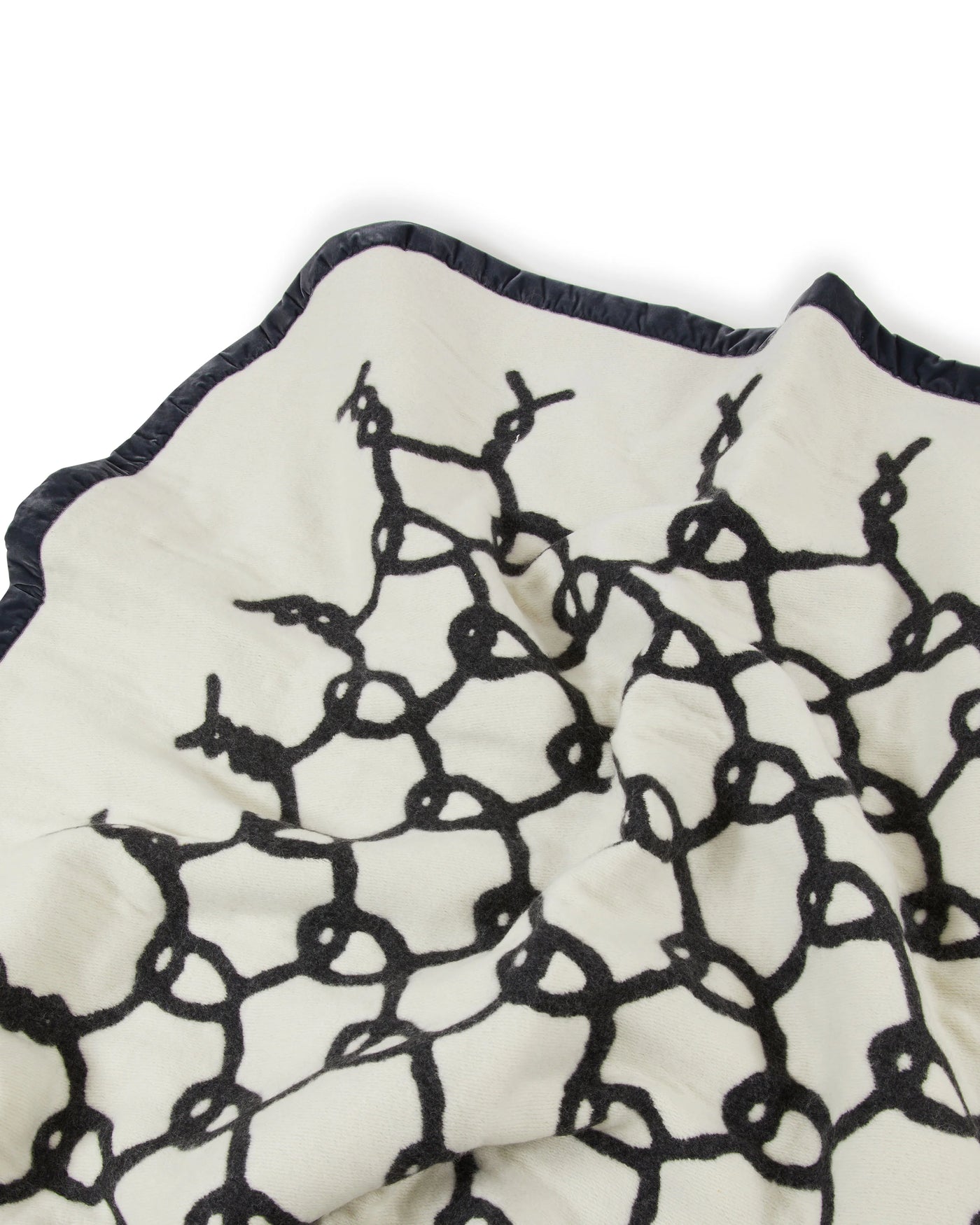 Lanerossi Net thermo blanket in ivory with black net embroidery pattern and contrast trim.