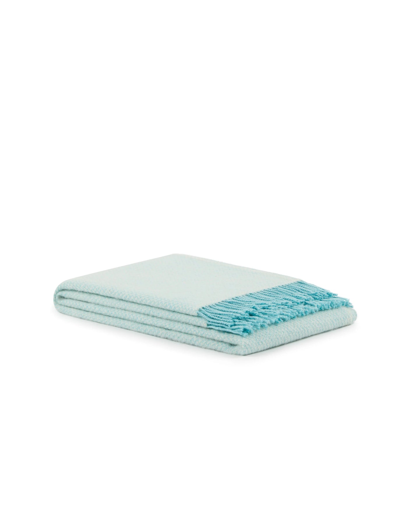 Folded aqua throw with knotted fringe trim, shown against white background.
