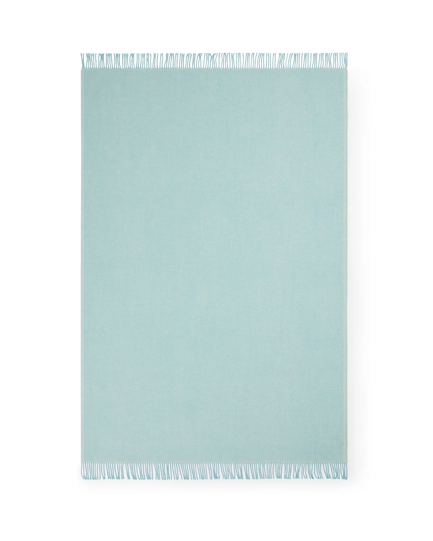 Lanerossi Northland throw in aqua, flat lay showing fringe trim detail along edges.