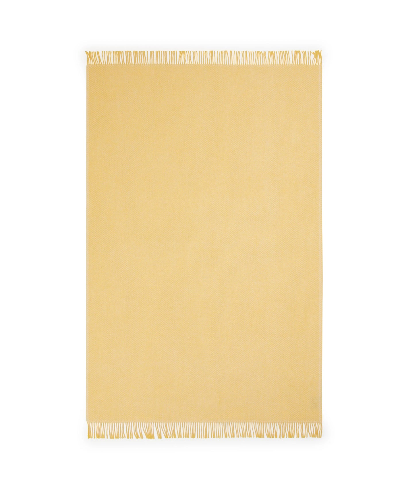 Lanerossi Northland throw in butter yellow with white fringe trim, flat lay view.