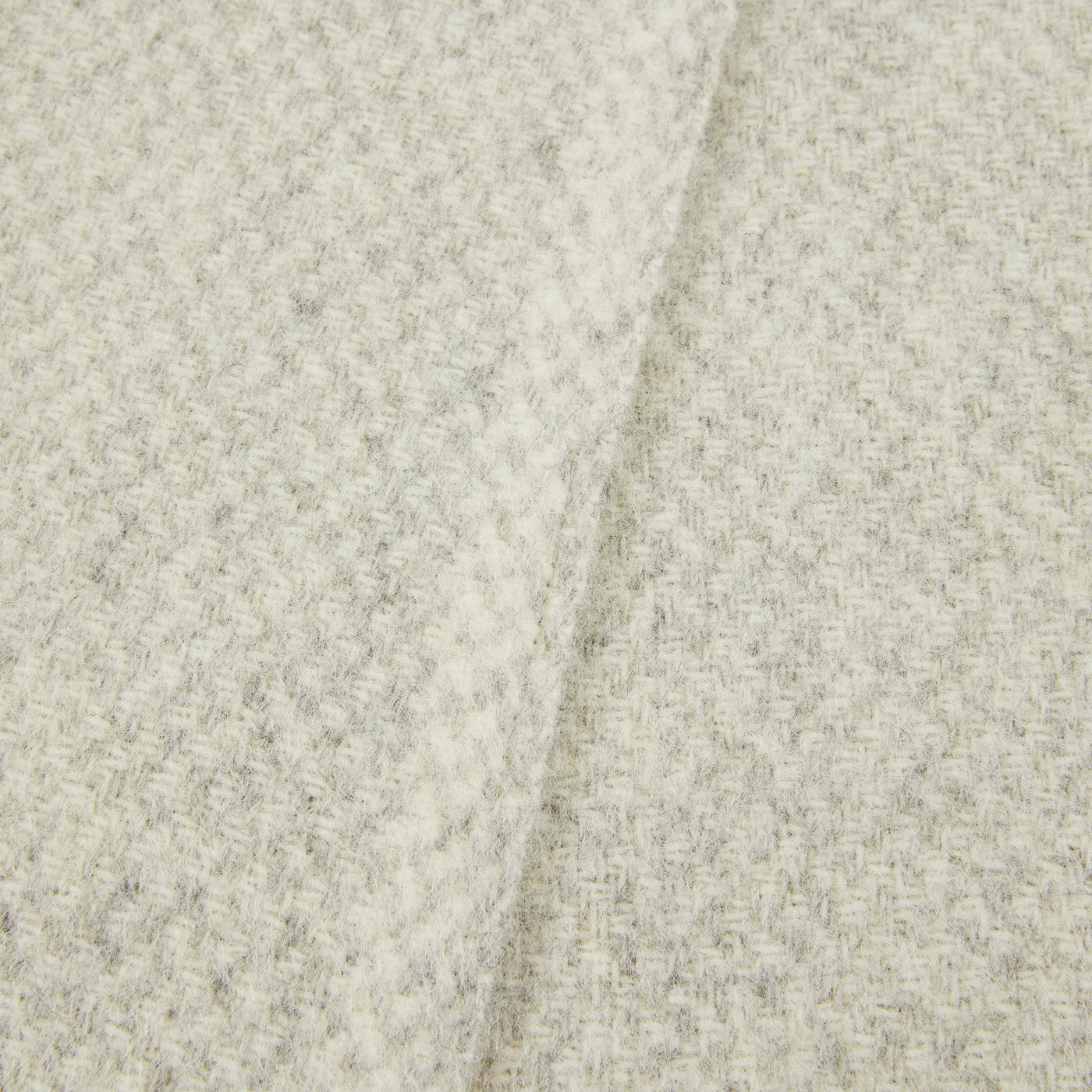 Close-up of Lanerossi Northland throw in ivory, showing textured houndstooth weave detail.