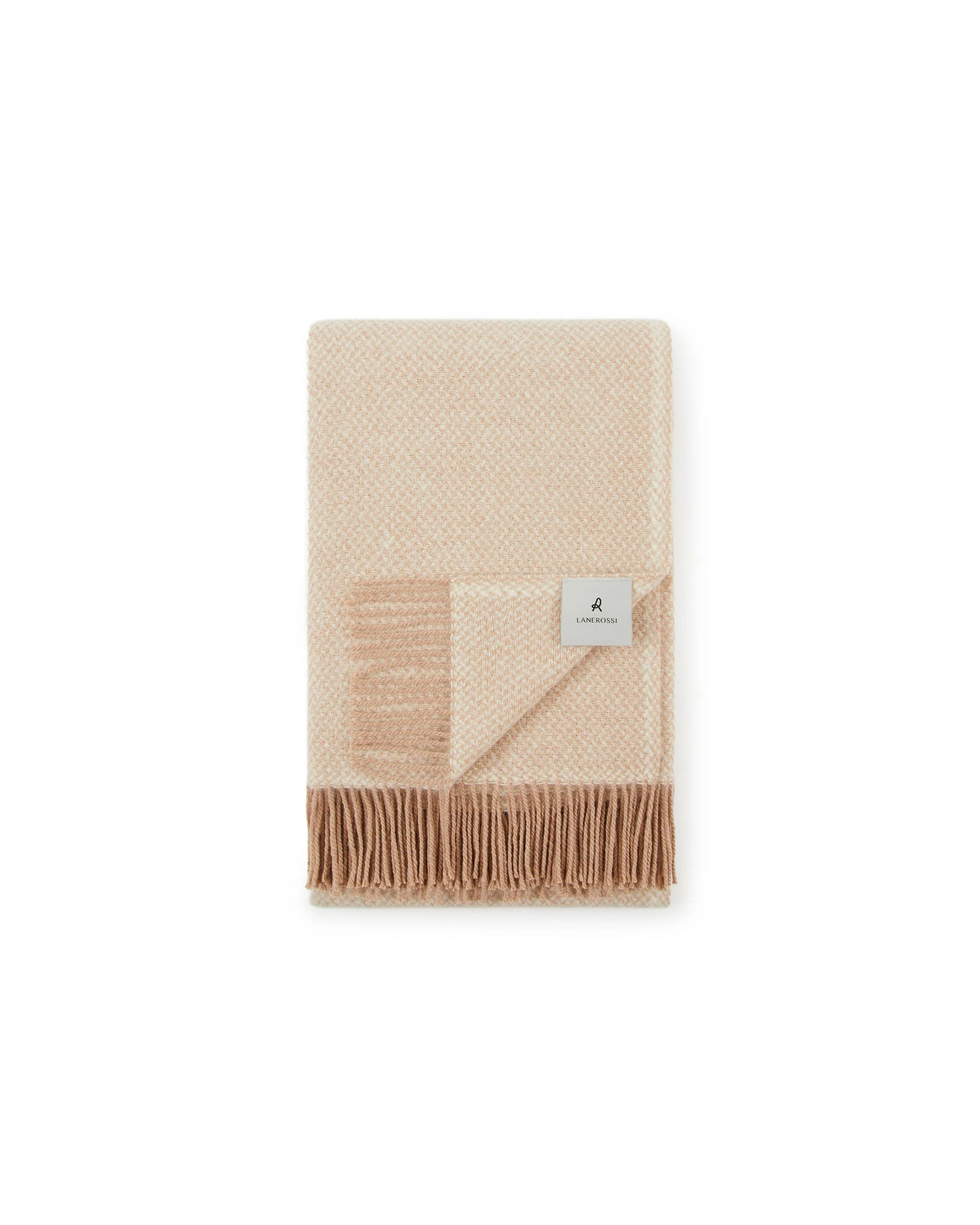 Folded ivory and champagne wool throw with fringe trim and Lanerossi brand label.