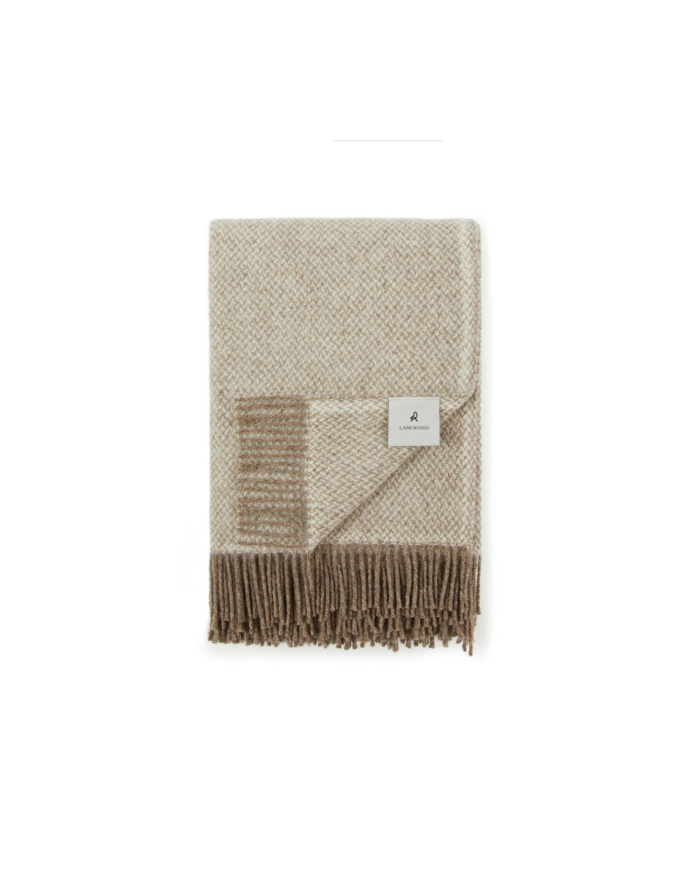 Folded ivory and taupe wool throw with fringe trim and woven label detail.