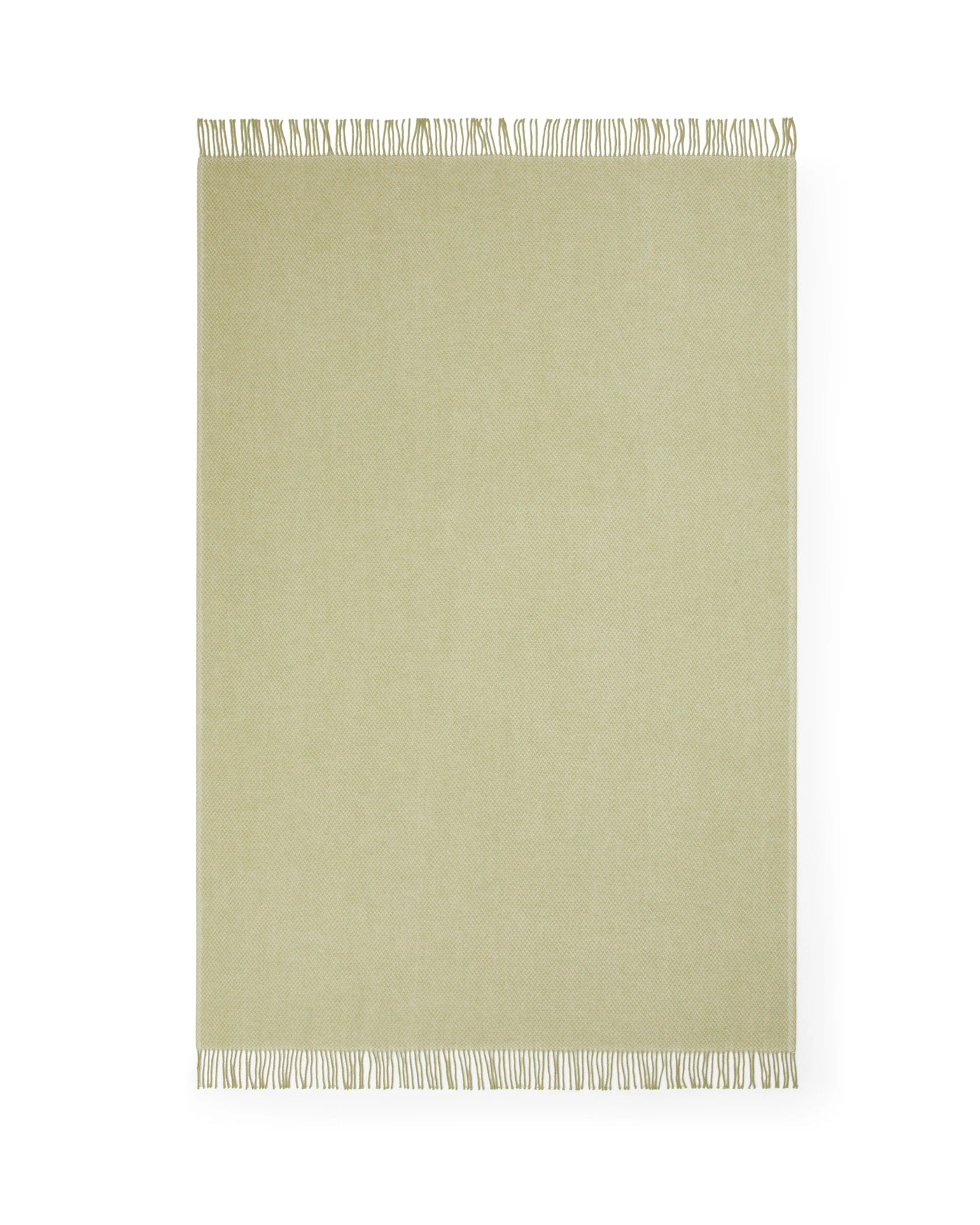 Sage green throw laid flat, showing fringe trim along top and bottom edges.