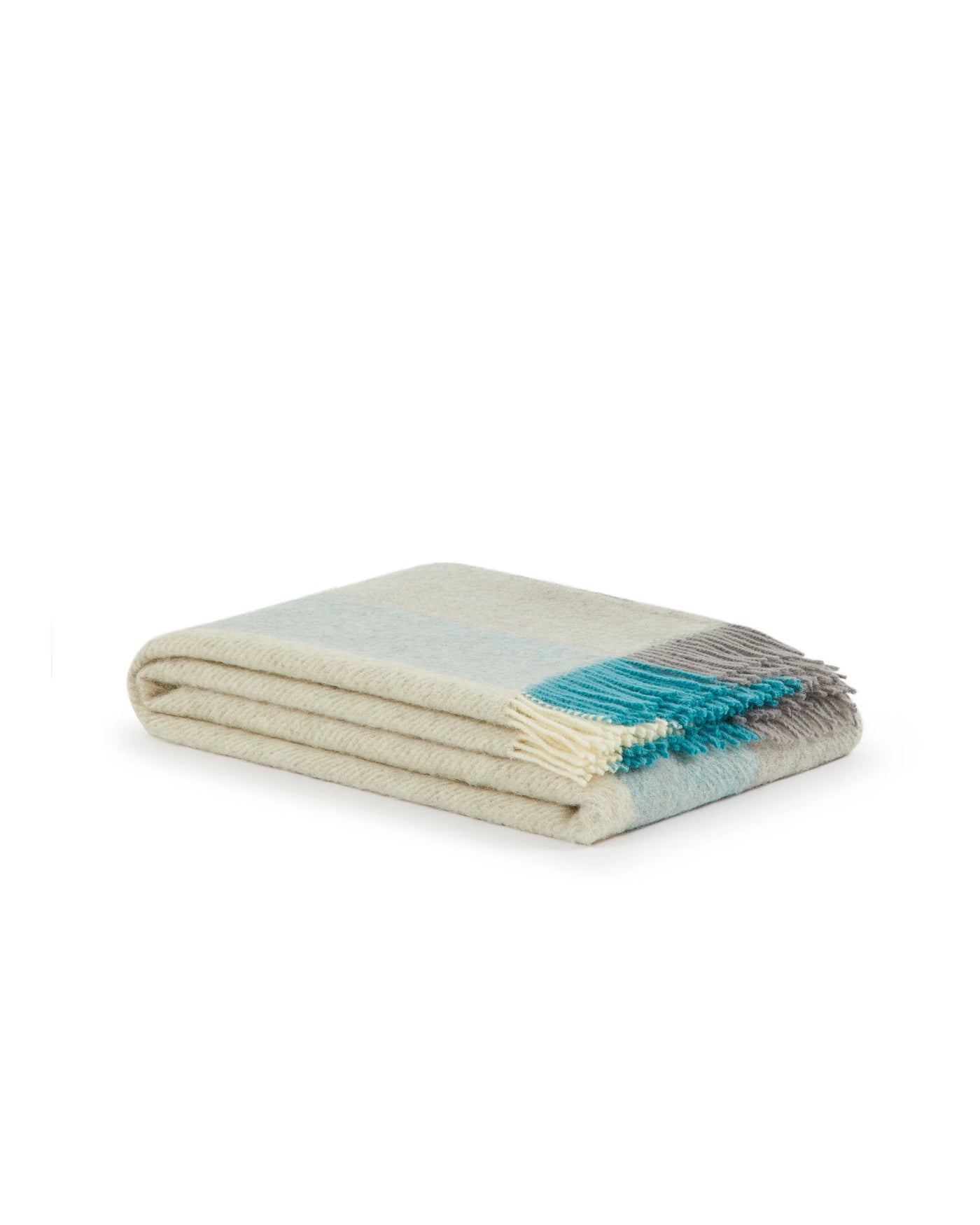Lanerossi Opua throw folded, ivory and aqua colorblock with fringe trim.
