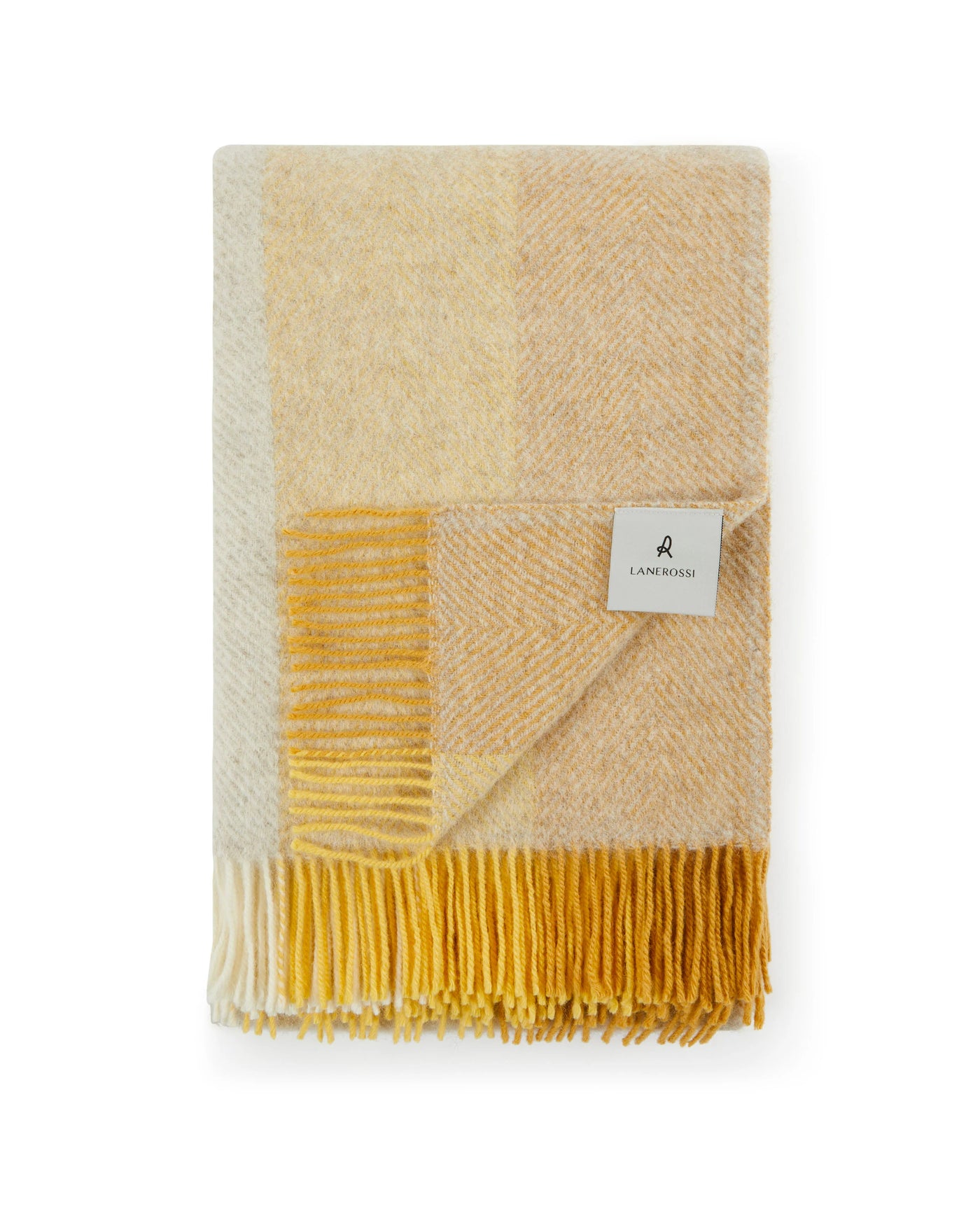 Folded Lanerossi Opua throw in ivory and gold plaid with fringe trim detail.