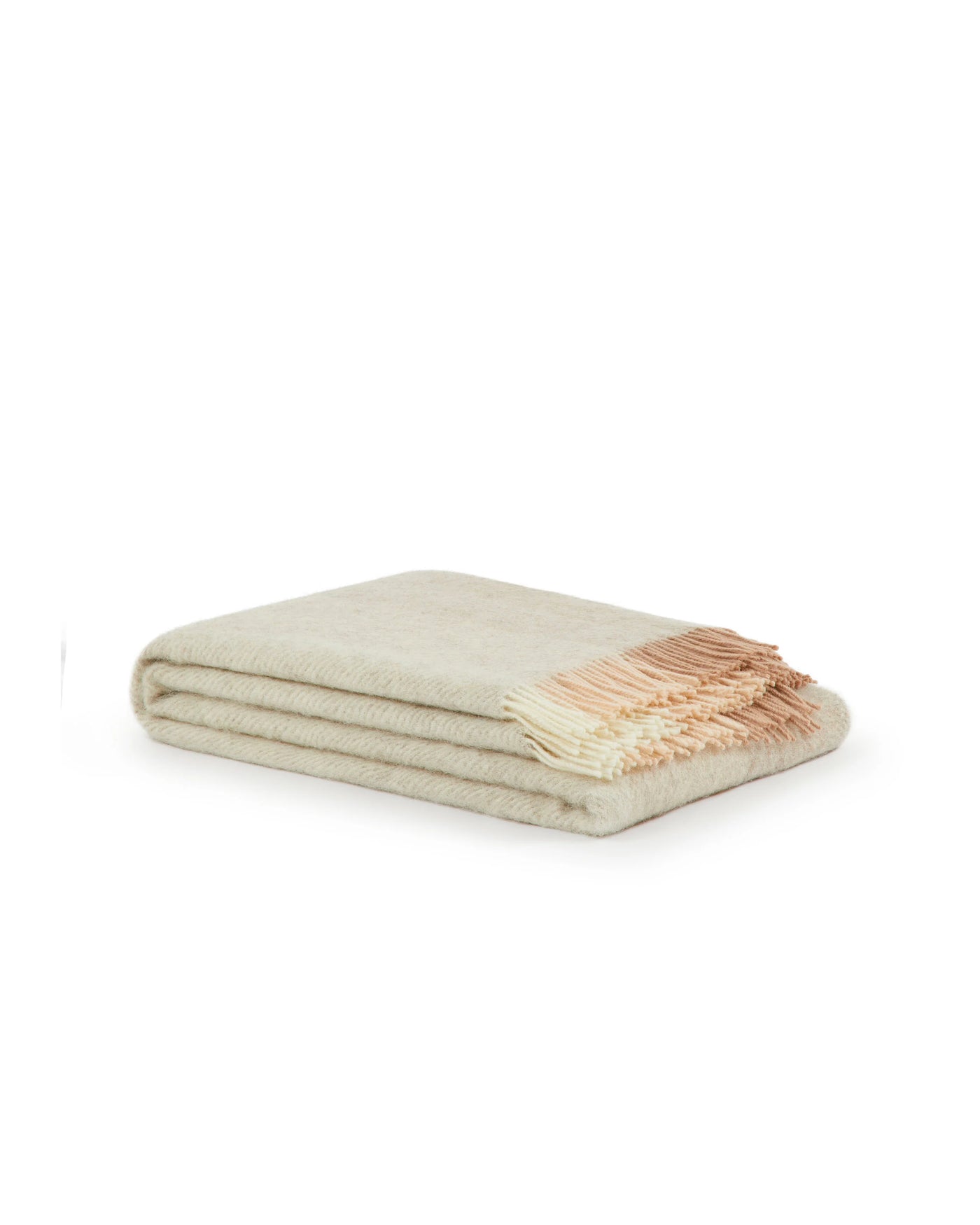 Folded ivory wool throw with blush fringe detail along one edge.