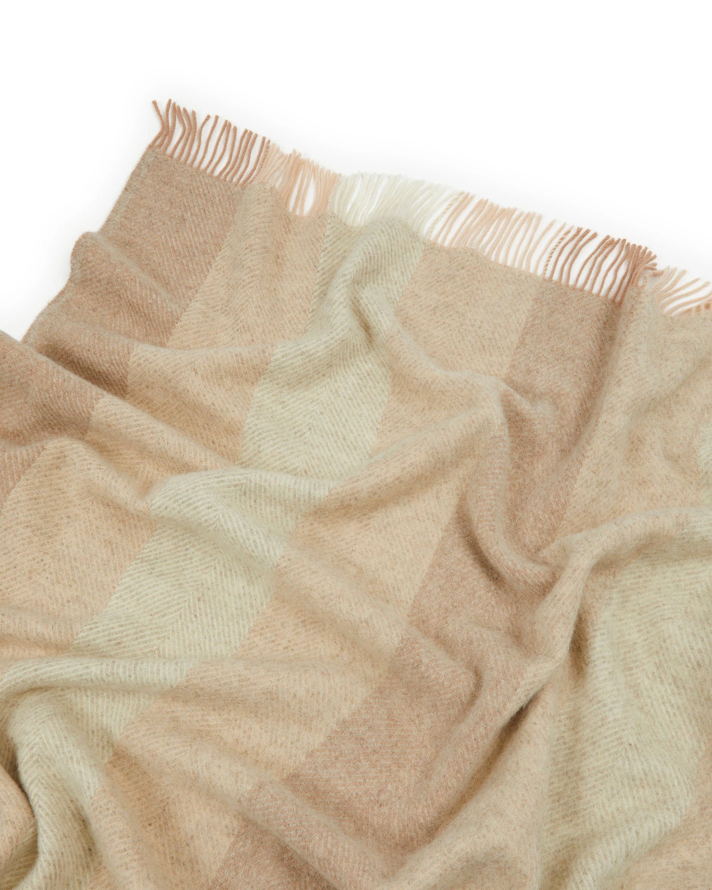 Lanerossi Opua throw close-up showing camel and sage check pattern with fringe trim.