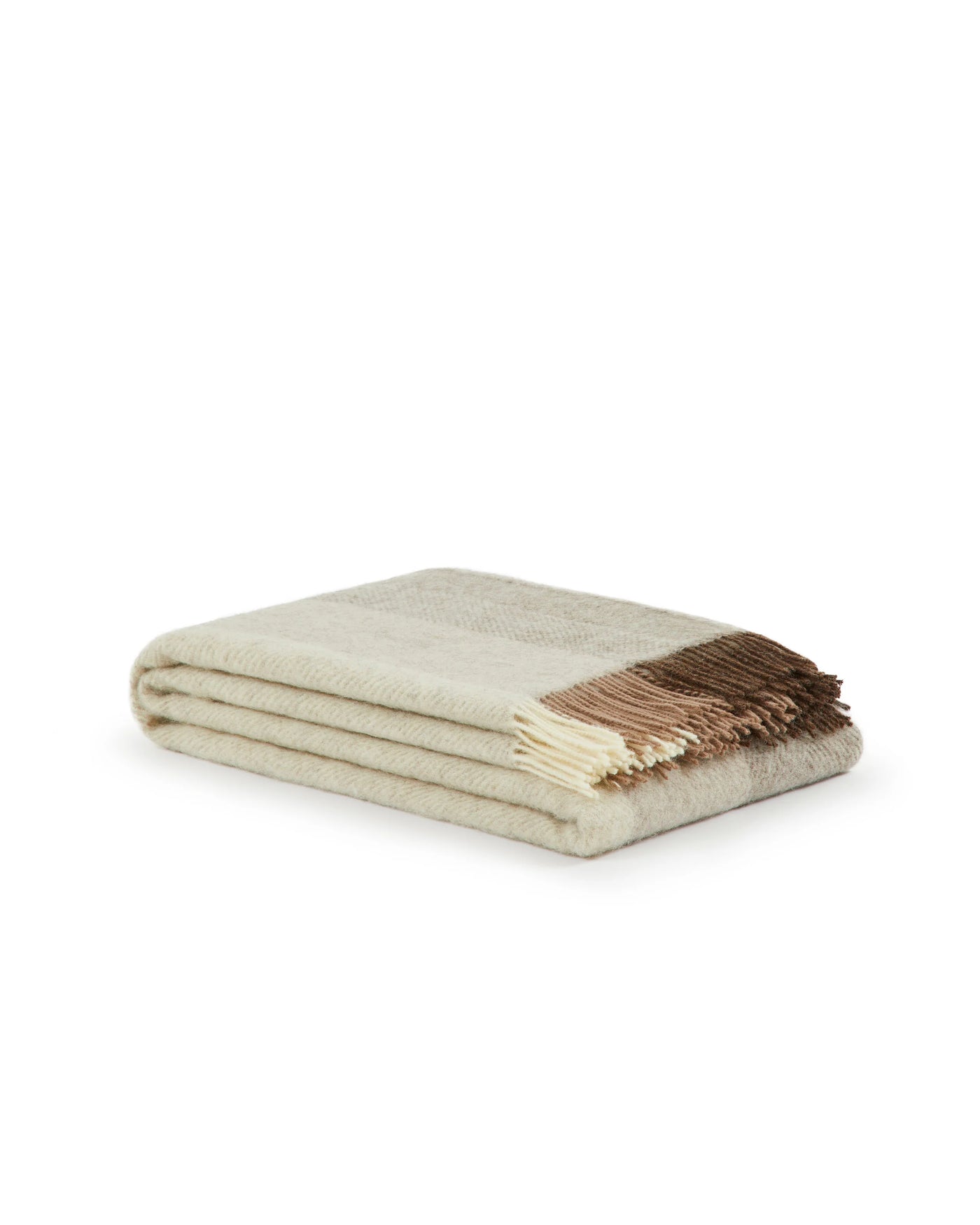 Folded ivory wool throw with brown and cream fringed edge detail.