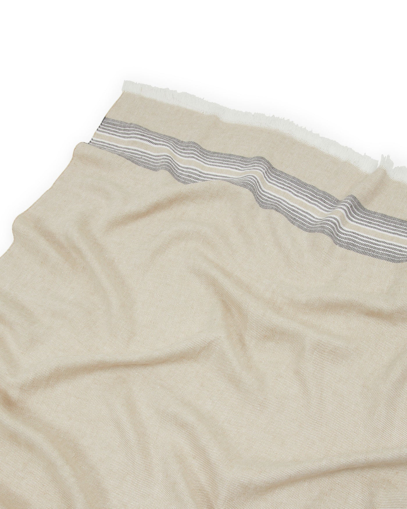 Close-up of Lanerossi Palau throw in sand with woven grey stripe border detail.