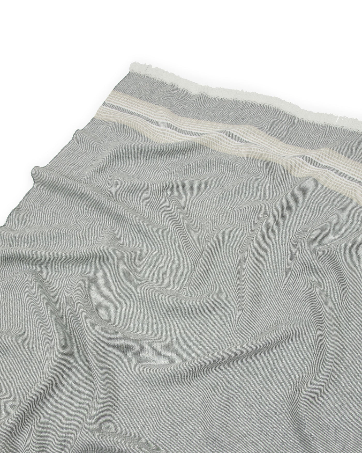 Close-up of Lanerossi Palau throw in grey, showing ivory stripe border and draped linen weave.