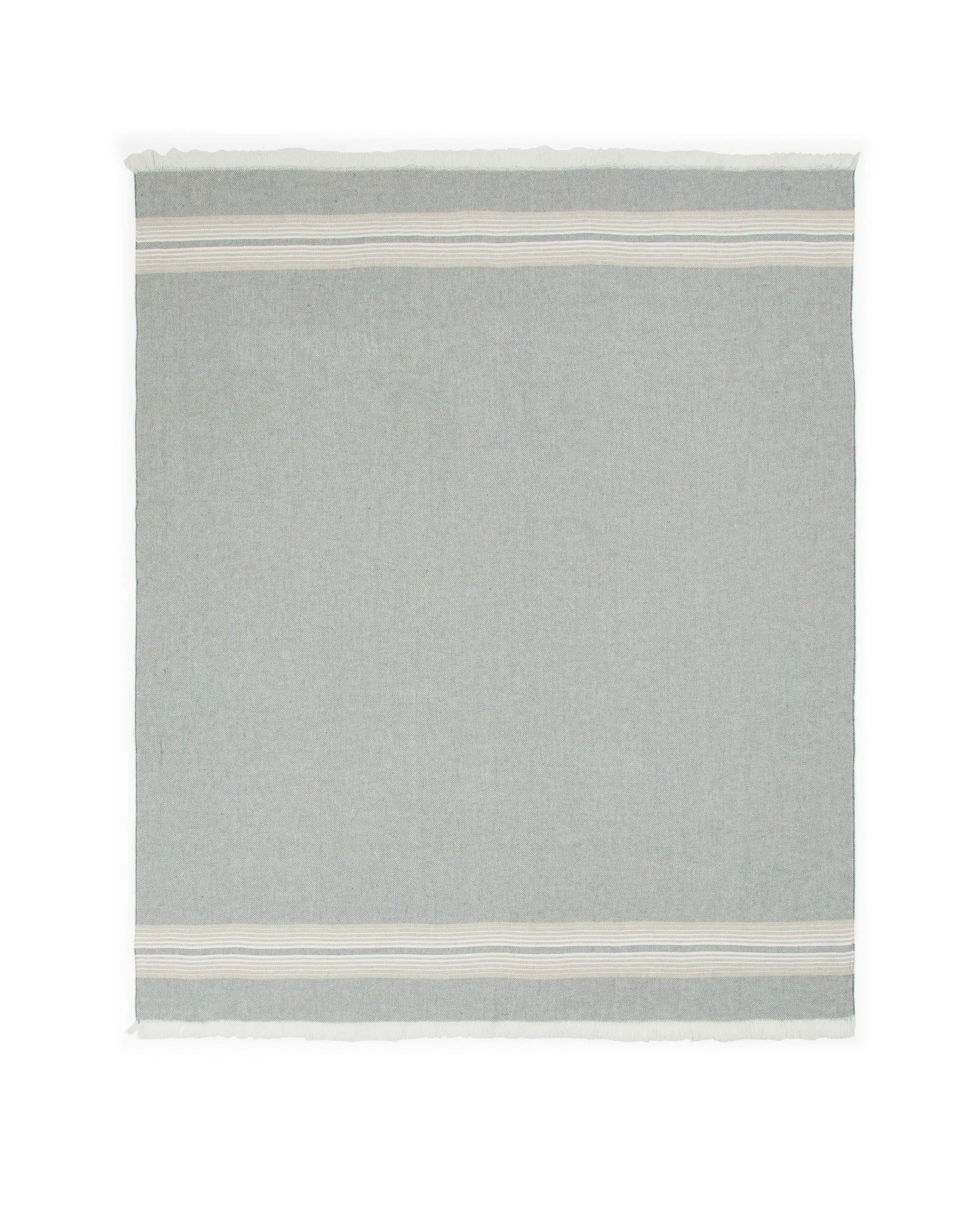 Lanerossi Palau throw in sage, fringe edges, ivory stripe border detail visible.