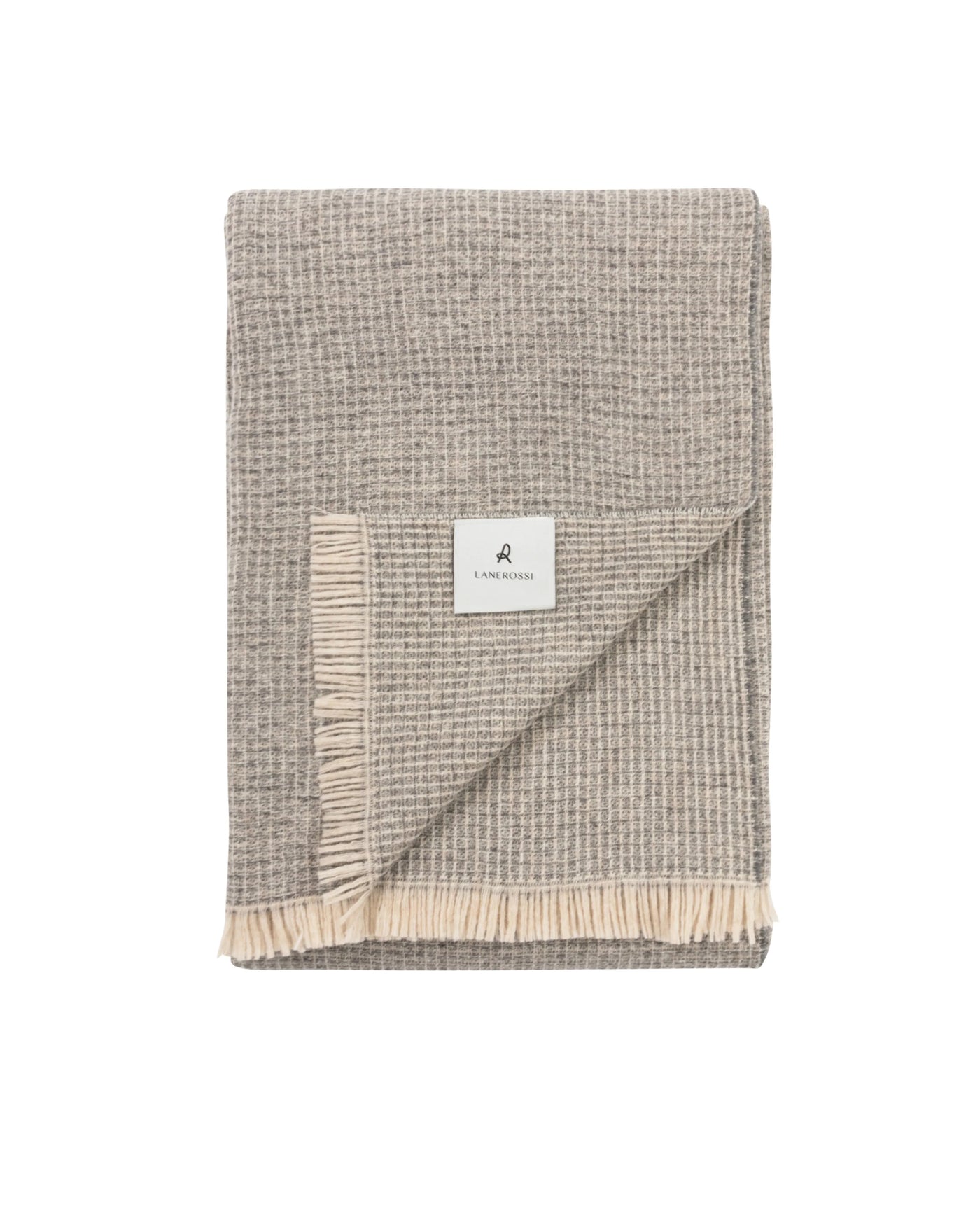 Lanerossi Rossi Moon throw folded flat, taupe waffle-weave with ivory fringe trim.