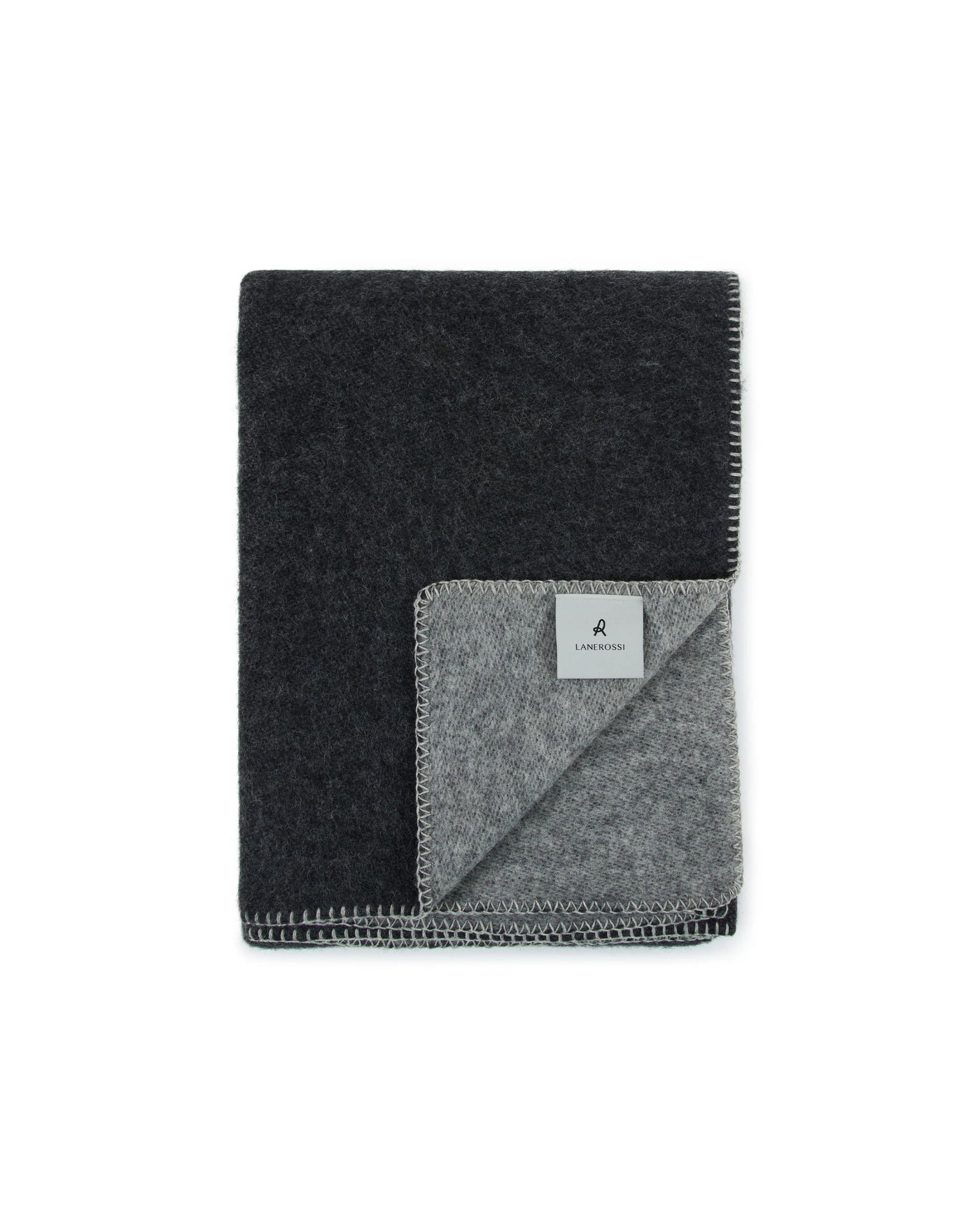 Reversible charcoal and silver grey wool throw, folded to show contrast sides and whipstitch trim.