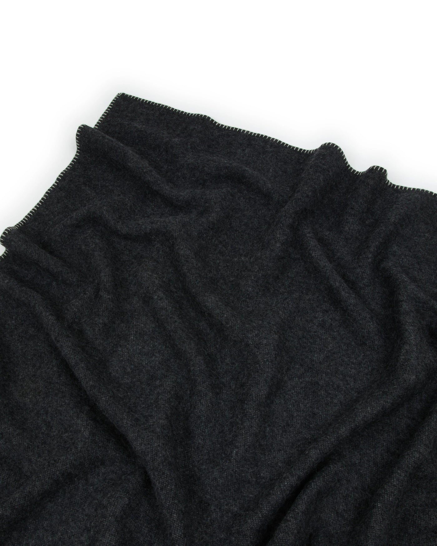 Close-up of charcoal Lanerossi Southland throw, showing blanket stitch edge detail.