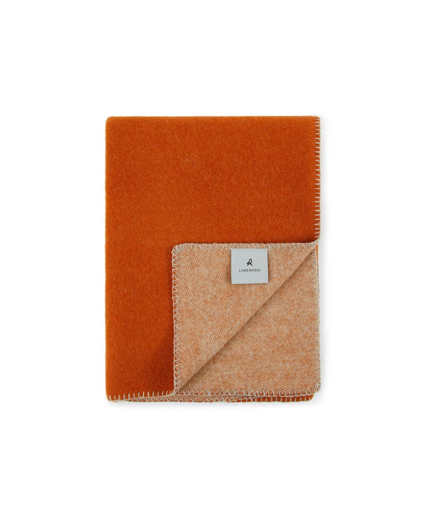 Corner fold revealing sandy reverse side with contrast blanket-stitch edge detail.