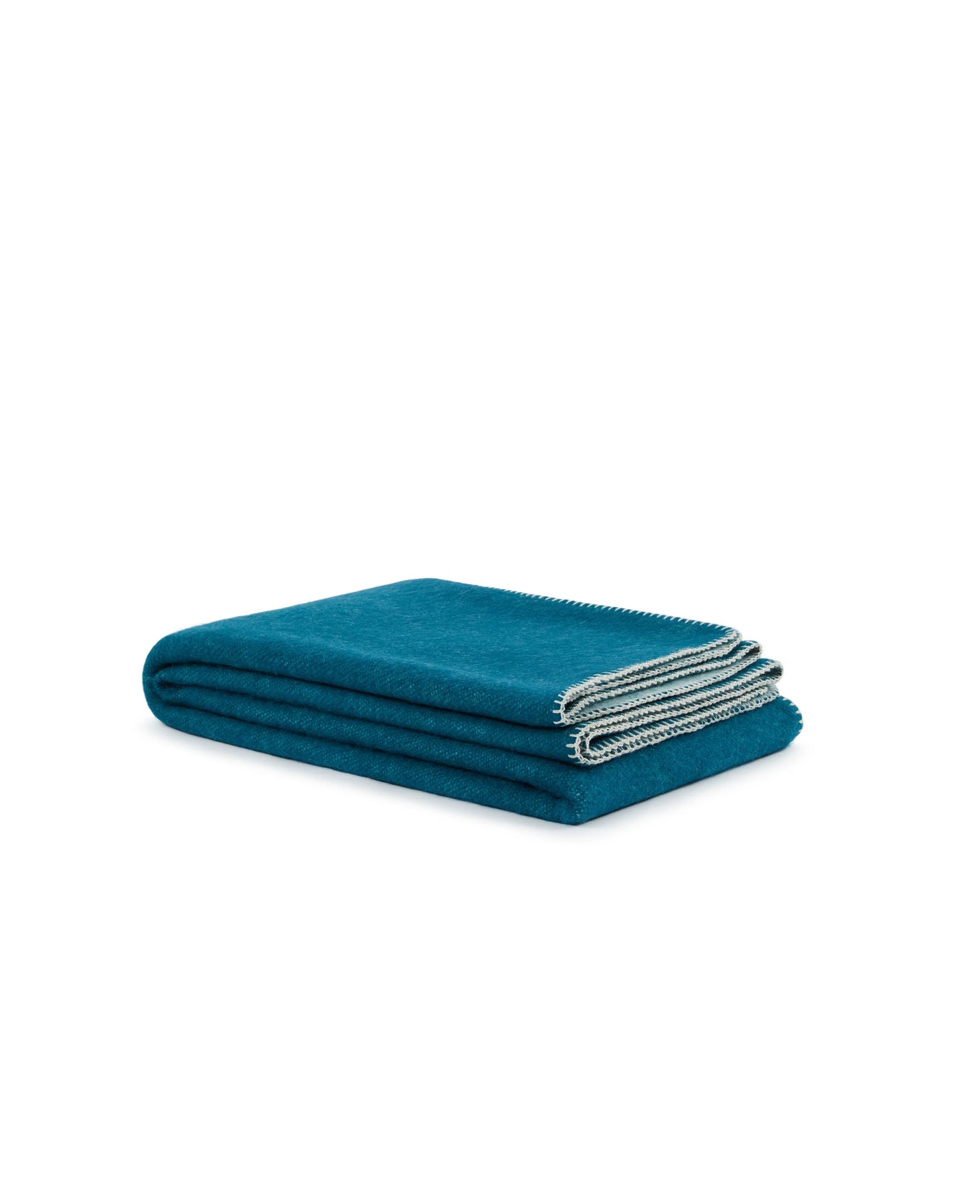 Folded teal wool throw with contrast grey blanket-stitch edge detail.
