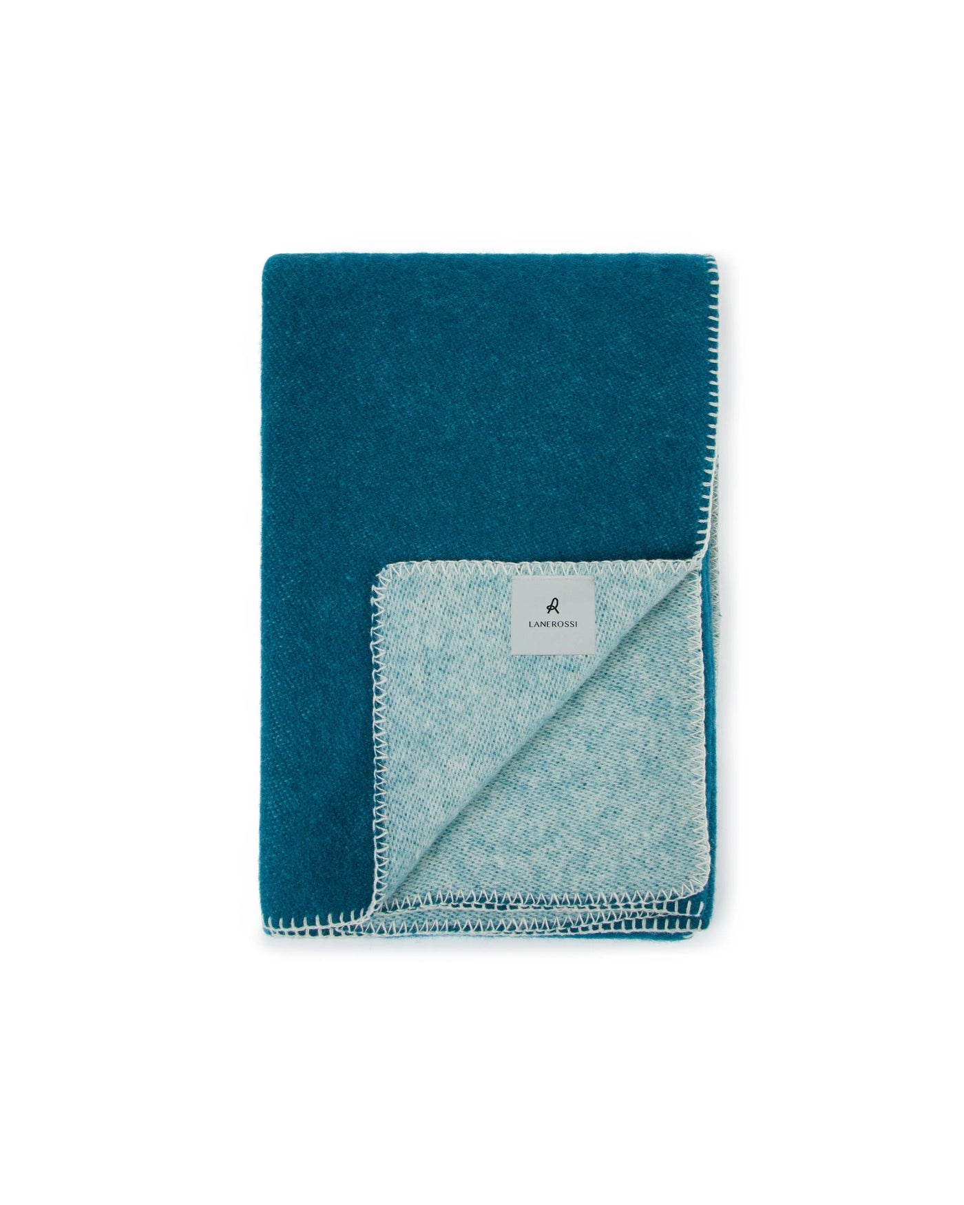Lanerossi Southland throw folded, teal top with pale blue herringbone reverse and whipstitch border.