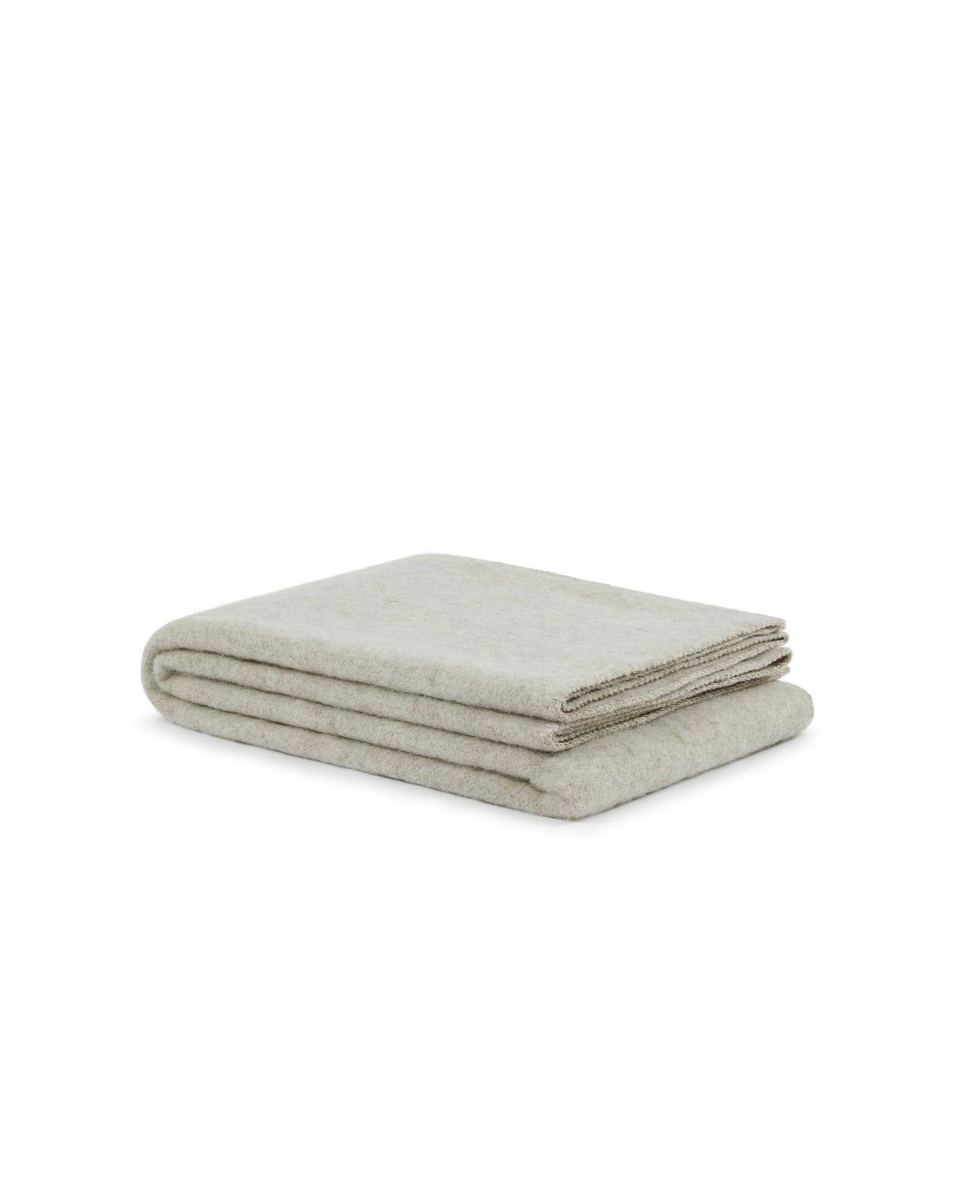Lanerossi Southland throw folded flat, oatmeal wool blend with subtle flecked texture.