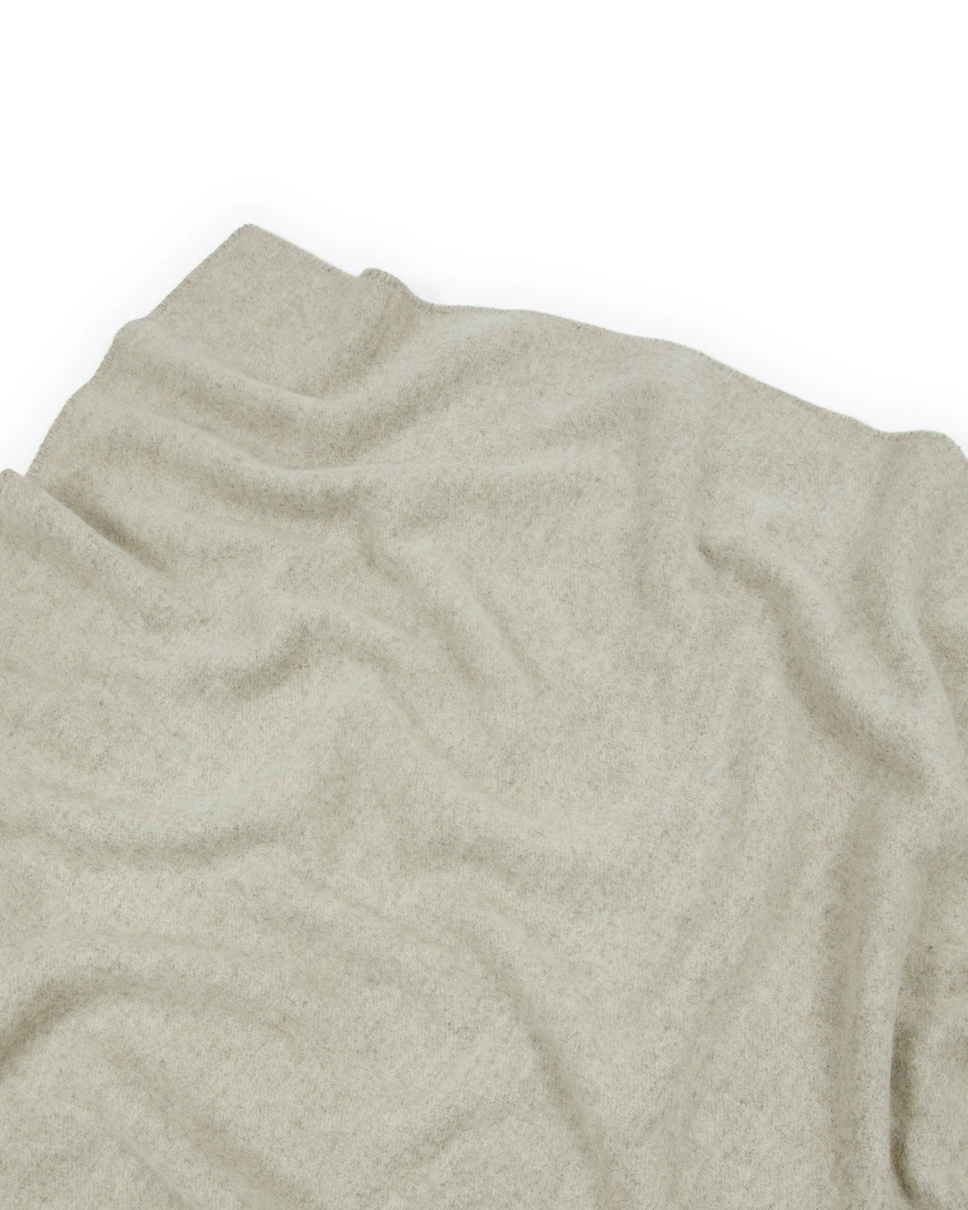 Close-up of Lanerossi Southland throw in oatmeal, showing soft draped wool texture.