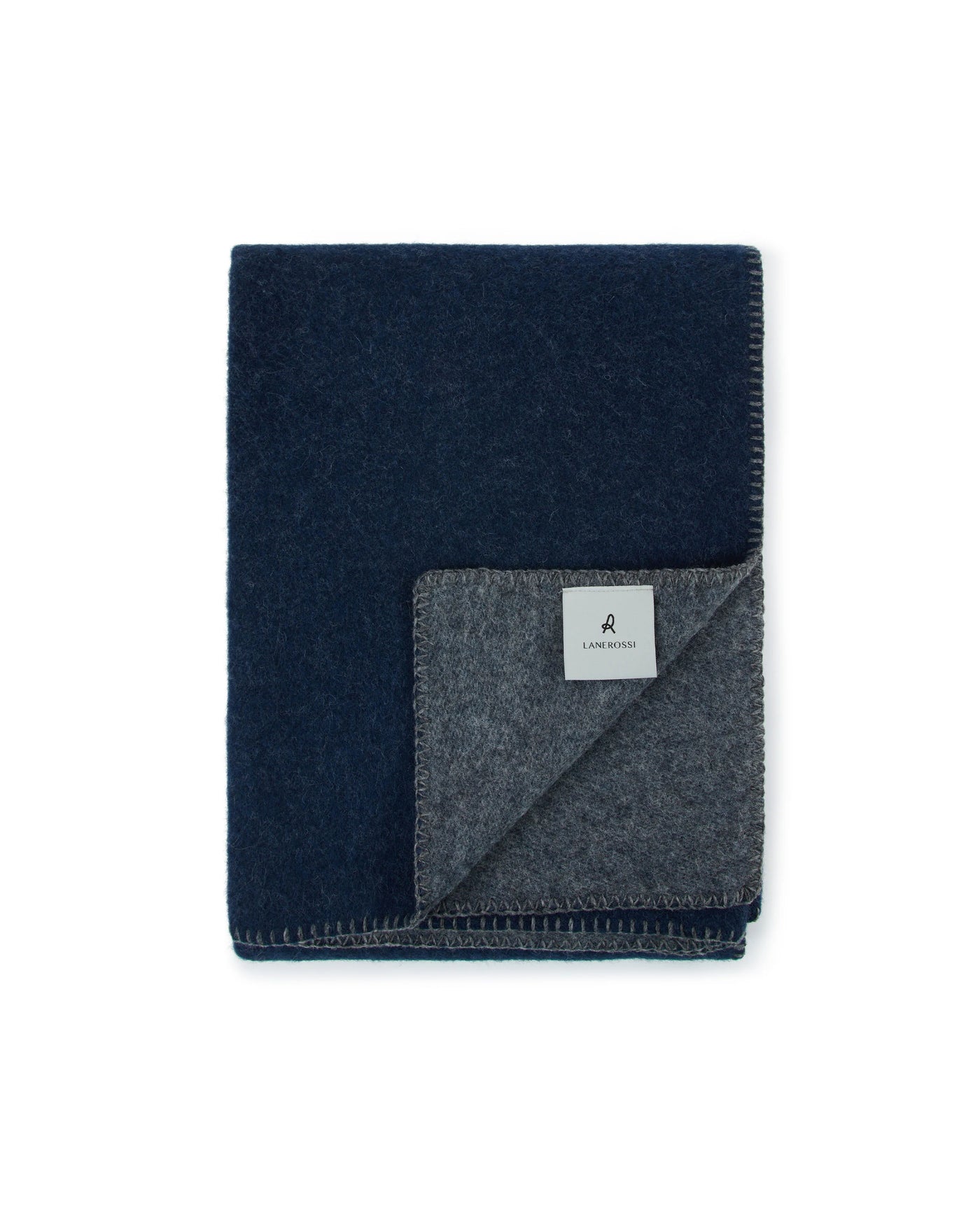 Lanerossi Southland throw folded flat, navy face with charcoal grey reverse and blanket-stitch edge.