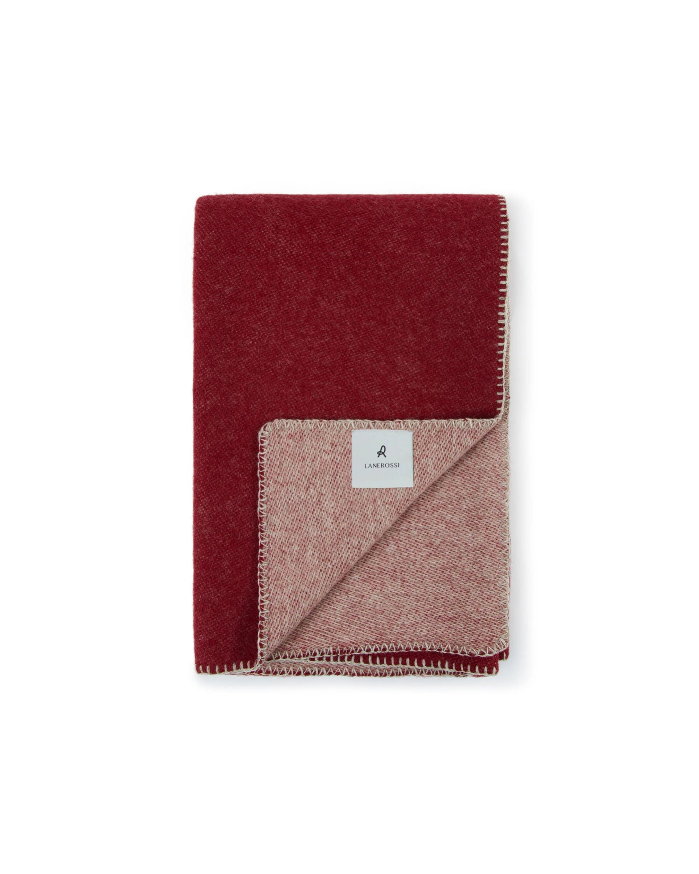 Lanerossi Southland throw folded, showing crimson and blush reversible wool with blanket-stitch edge.