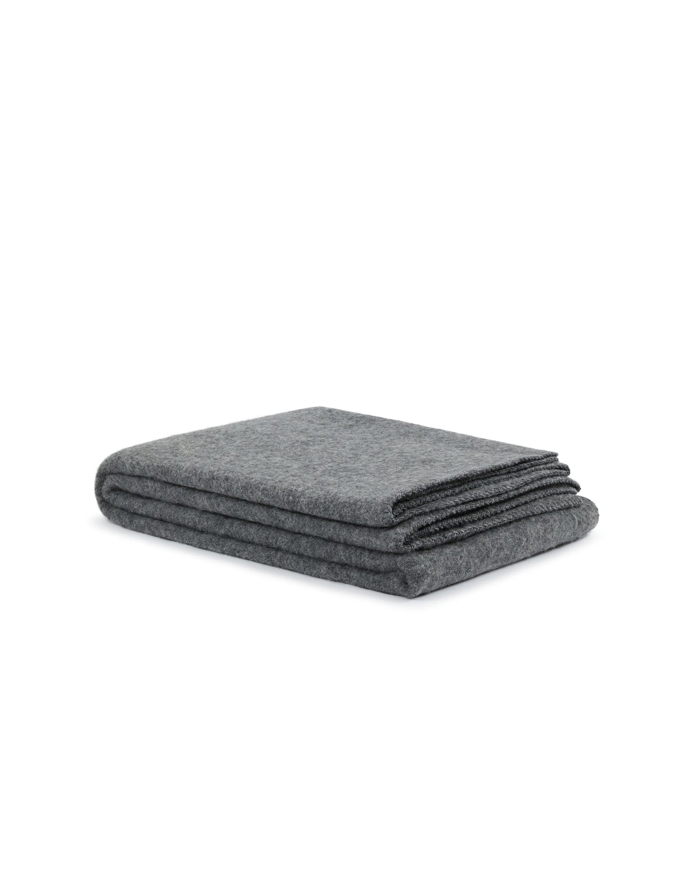Lanerossi Southland throw folded flat, charcoal grey wool, angled side view.