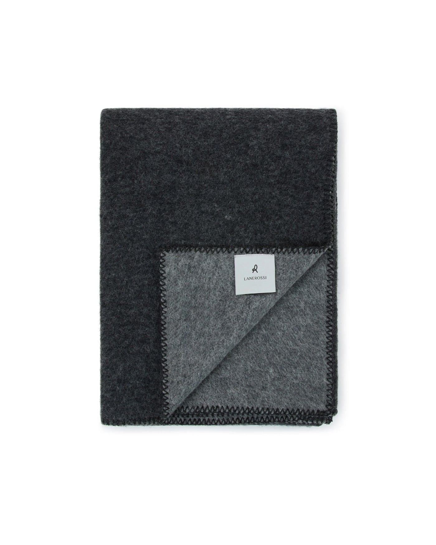 Corner fold detail showing Lanerossi Southland throw's charcoal and silver reversible wool.