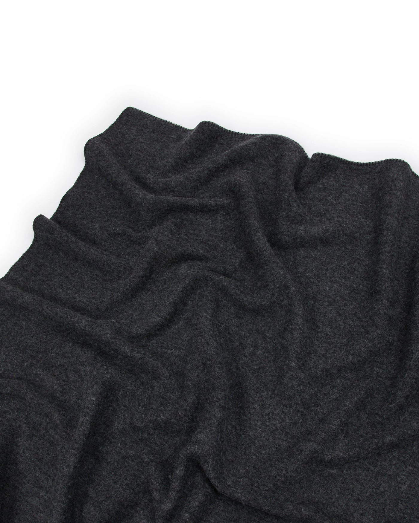 Close-up of Lanerossi Southland throw in charcoal, showing soft draped wool texture.